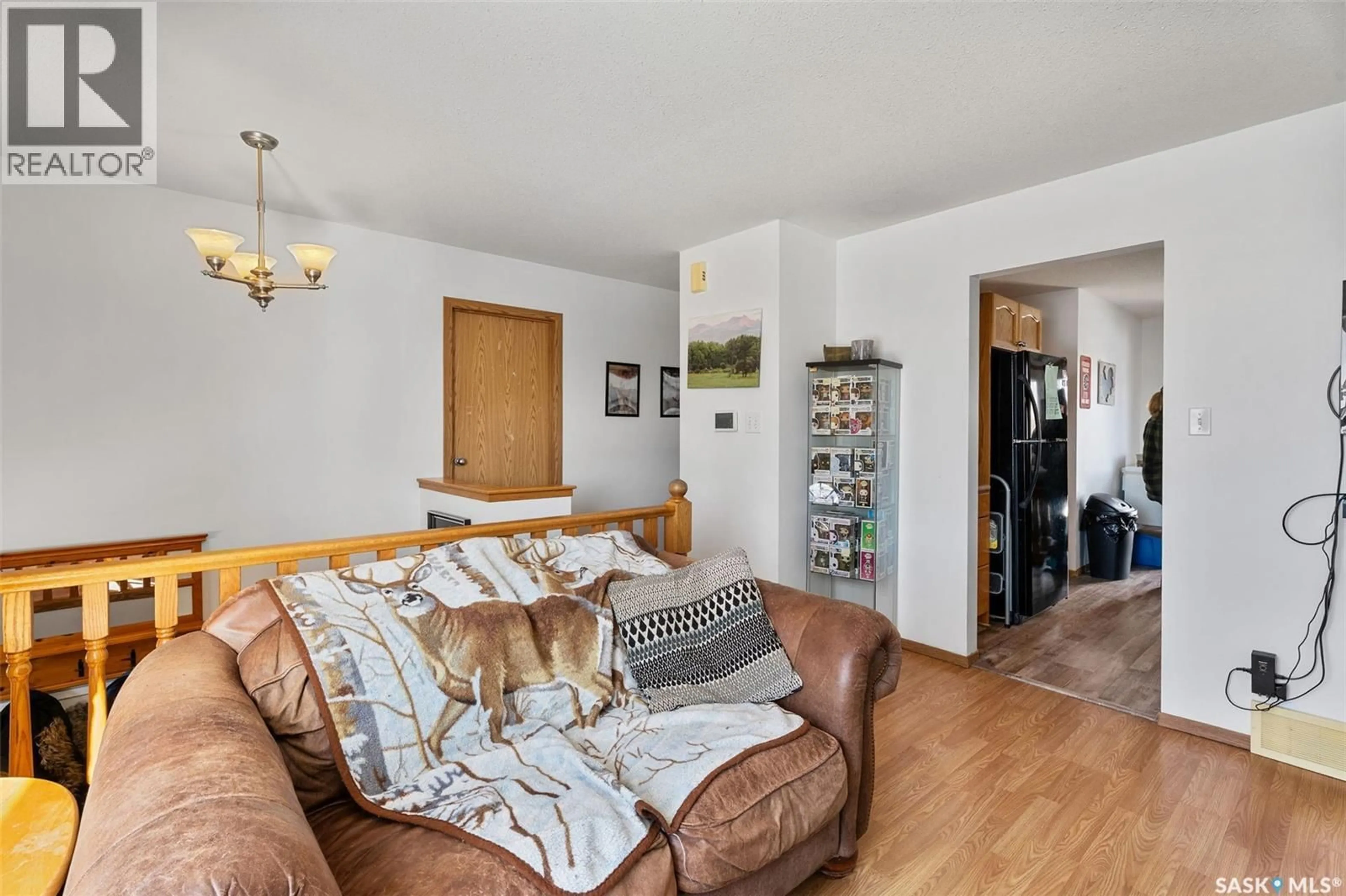 Living room with furniture, wood/laminate floor for 3132 WEIR ROAD, Prince Albert Saskatchewan S6V0A5