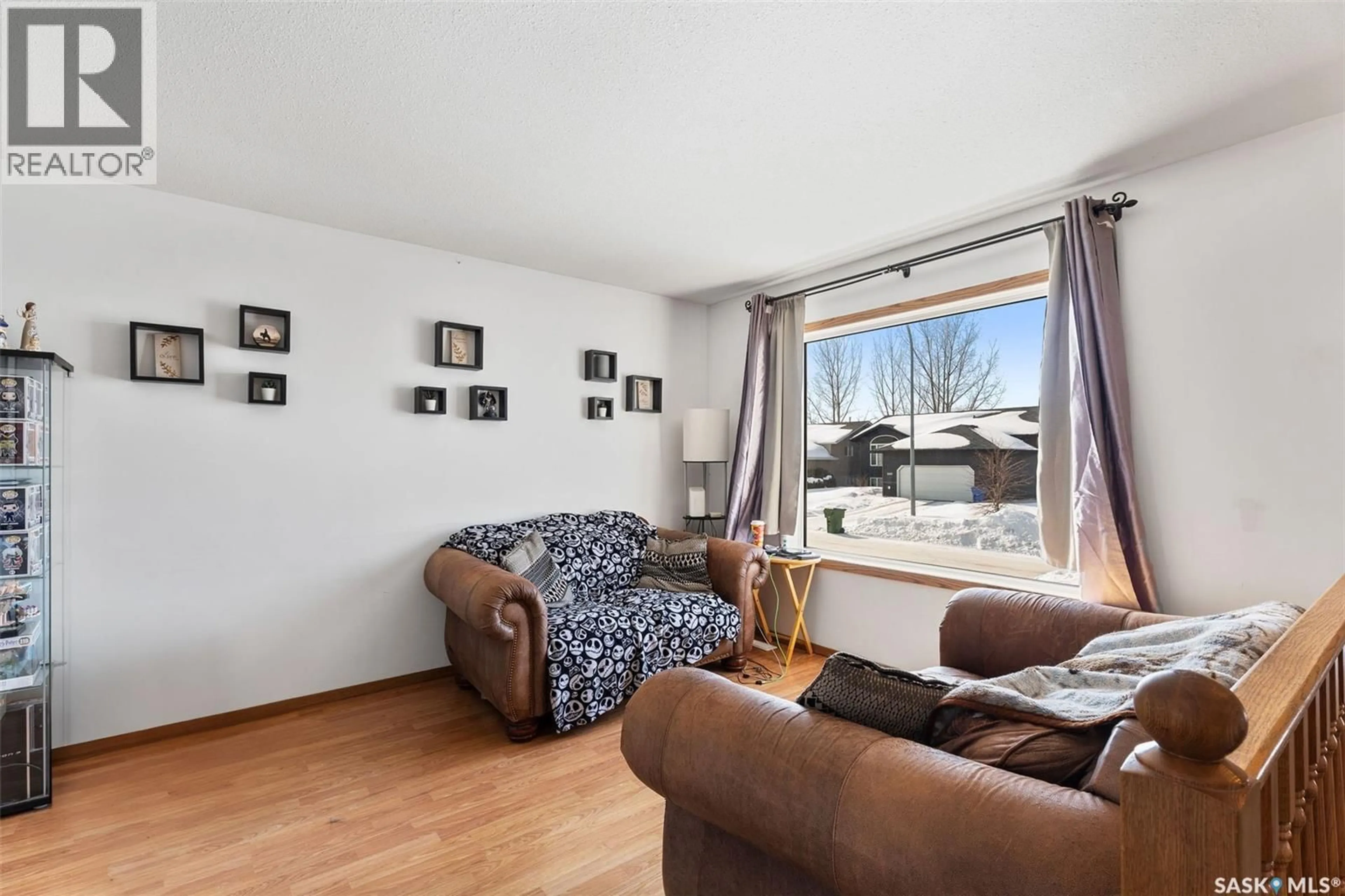 Living room with furniture, wood/laminate floor for 3132 WEIR ROAD, Prince Albert Saskatchewan S6V0A5