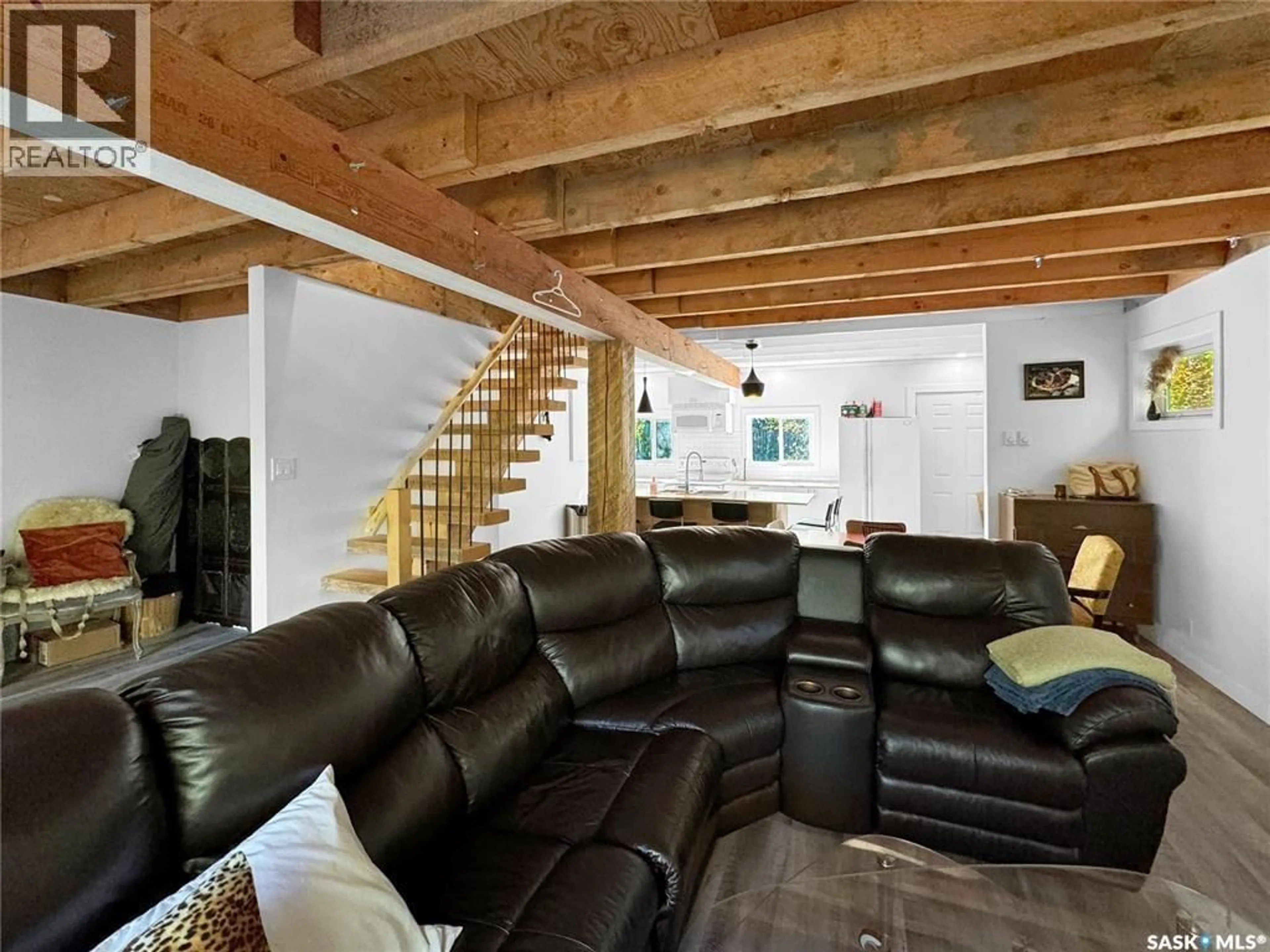 Living room with furniture, wood/laminate floor for 85 PINCHERRY CRESCENT, Cut Knife Rm No. 439 Saskatchewan S0M0N0