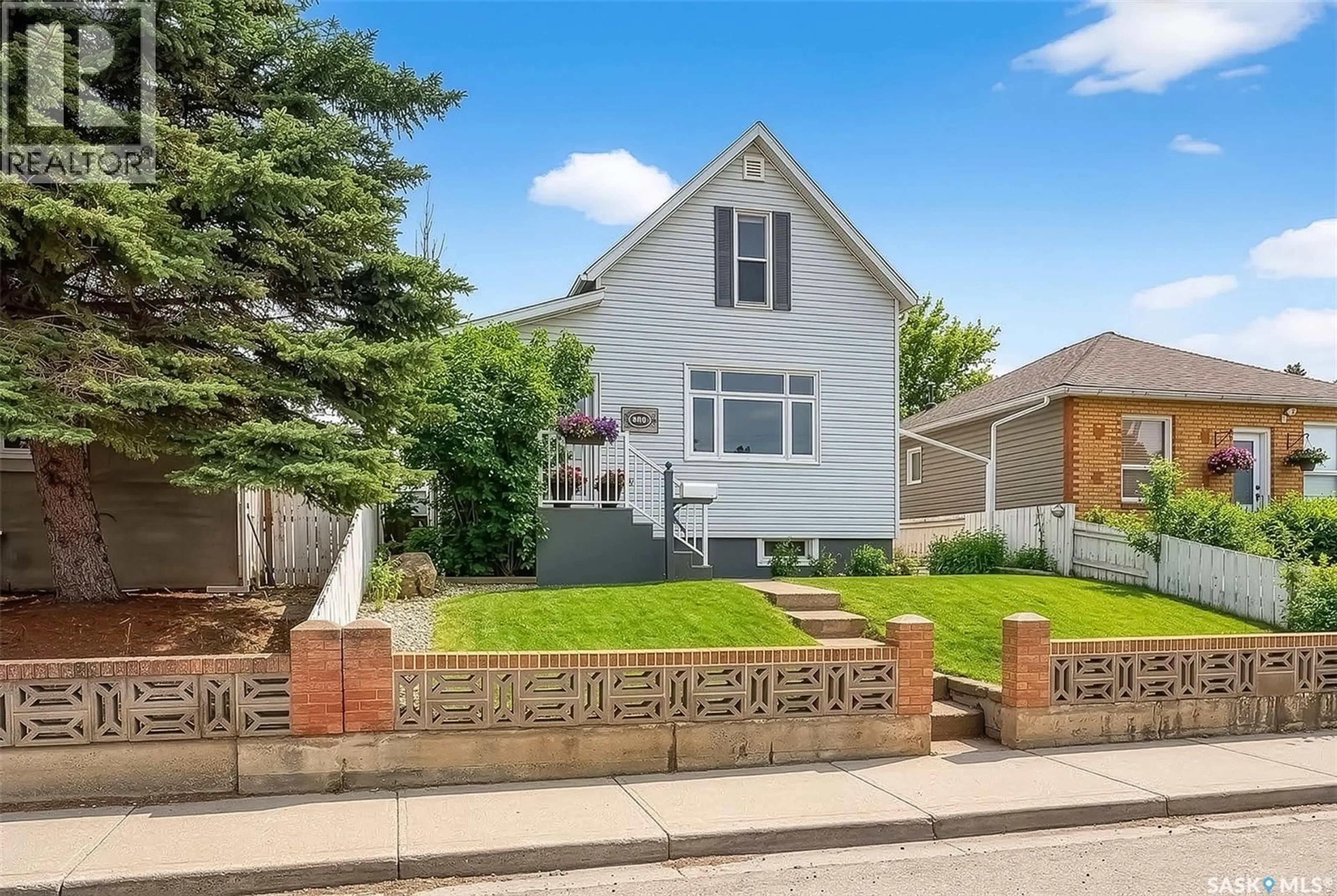 Home with brick exterior material, street for 1037 LILLOOET STREET, Moose Jaw Saskatchewan S6H4Z9