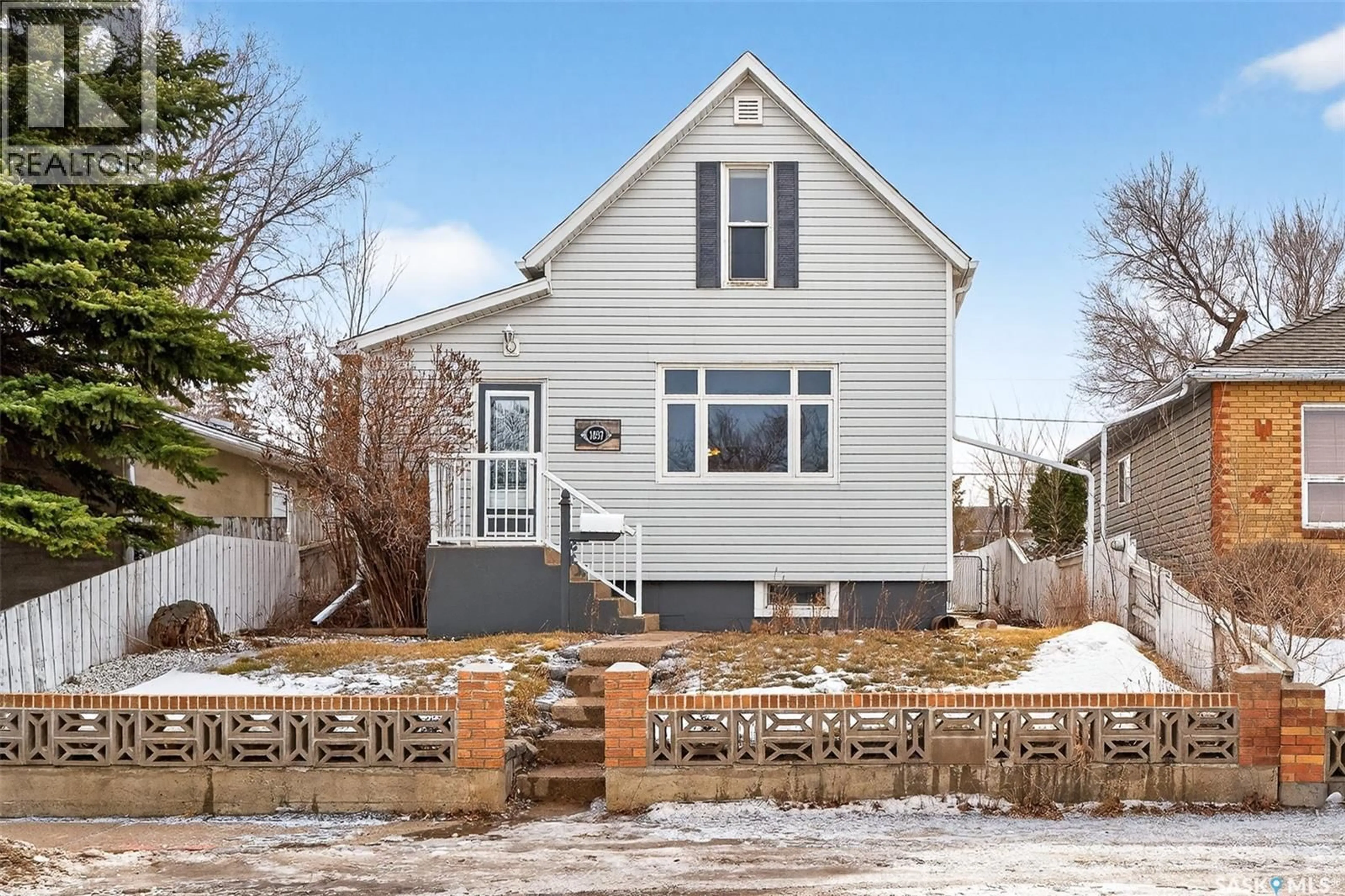 Home with vinyl exterior material, street for 1037 LILLOOET STREET, Moose Jaw Saskatchewan S6H4Z9