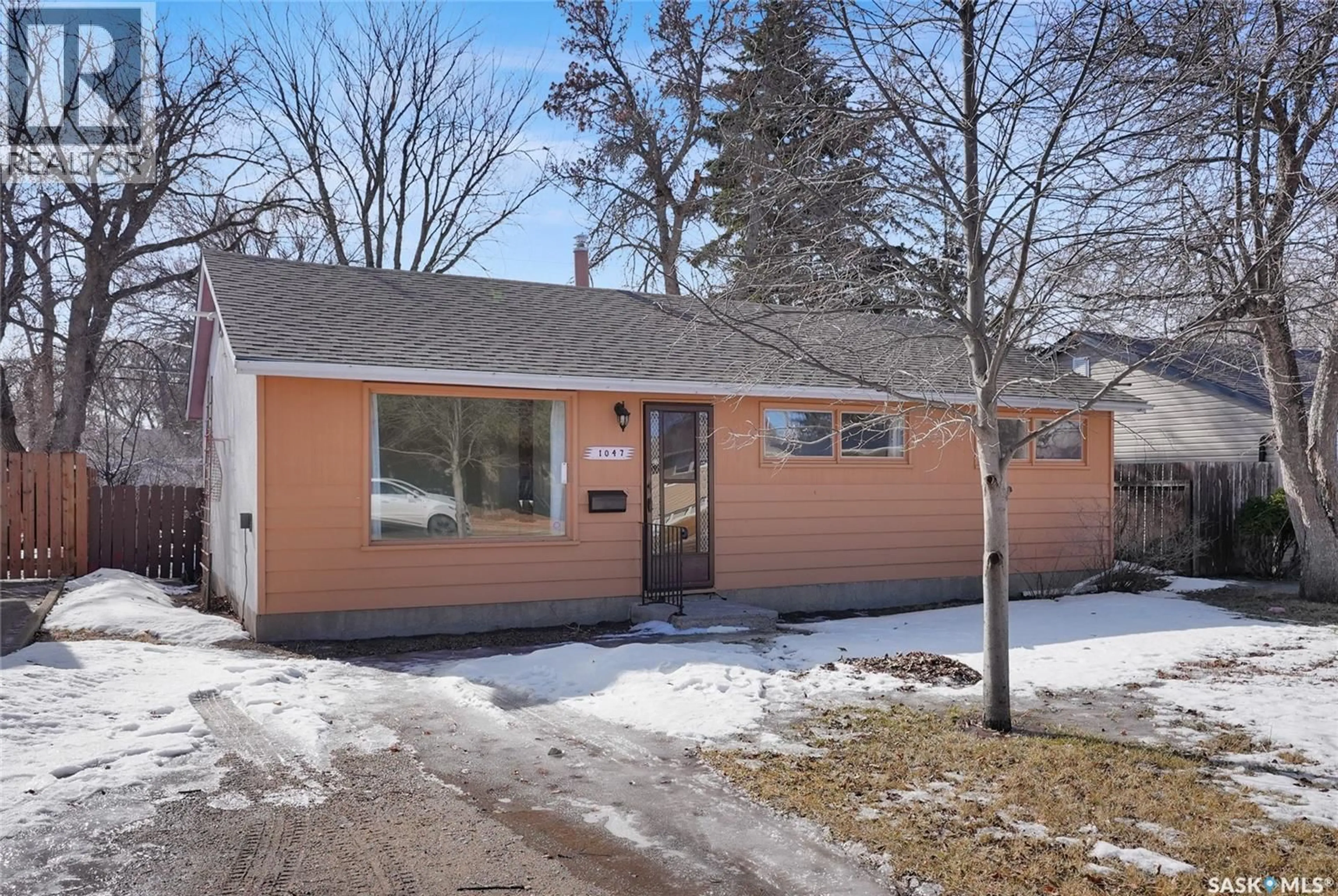 Home with vinyl exterior material, street for 1047 CARLETON STREET, Moose Jaw Saskatchewan S6H3A3
