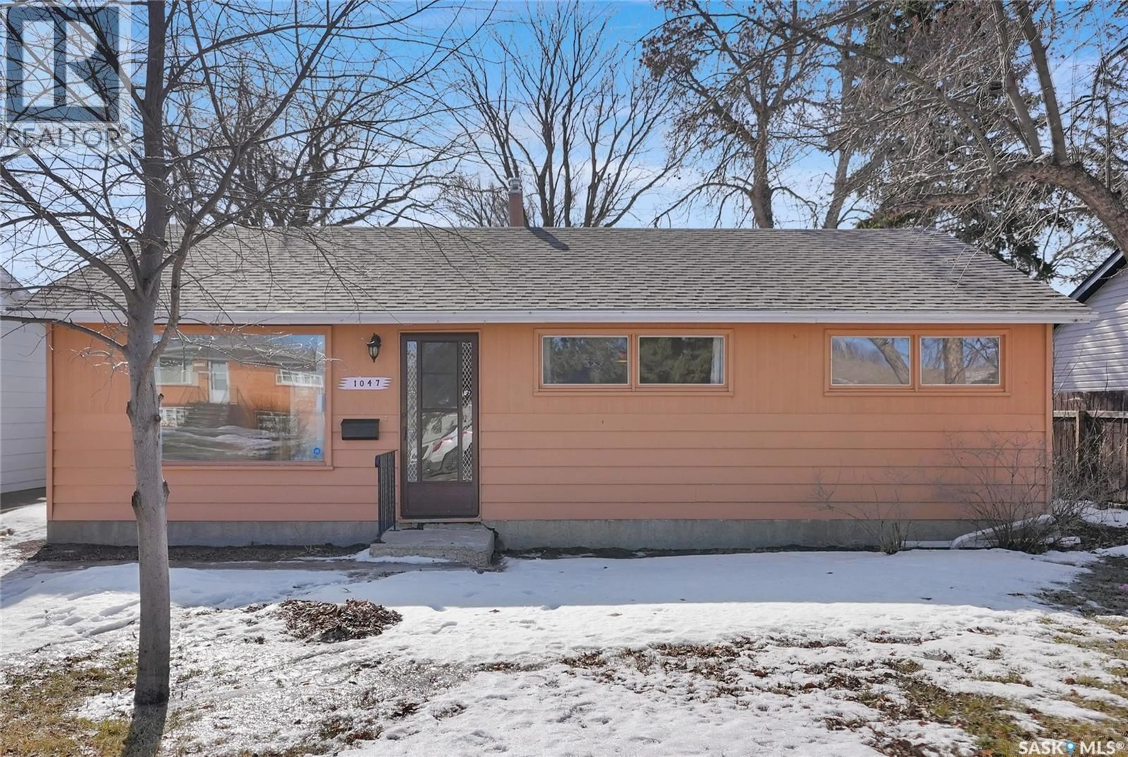 Home with vinyl exterior material, street for 1047 CARLETON STREET, Moose Jaw Saskatchewan S6H3A3