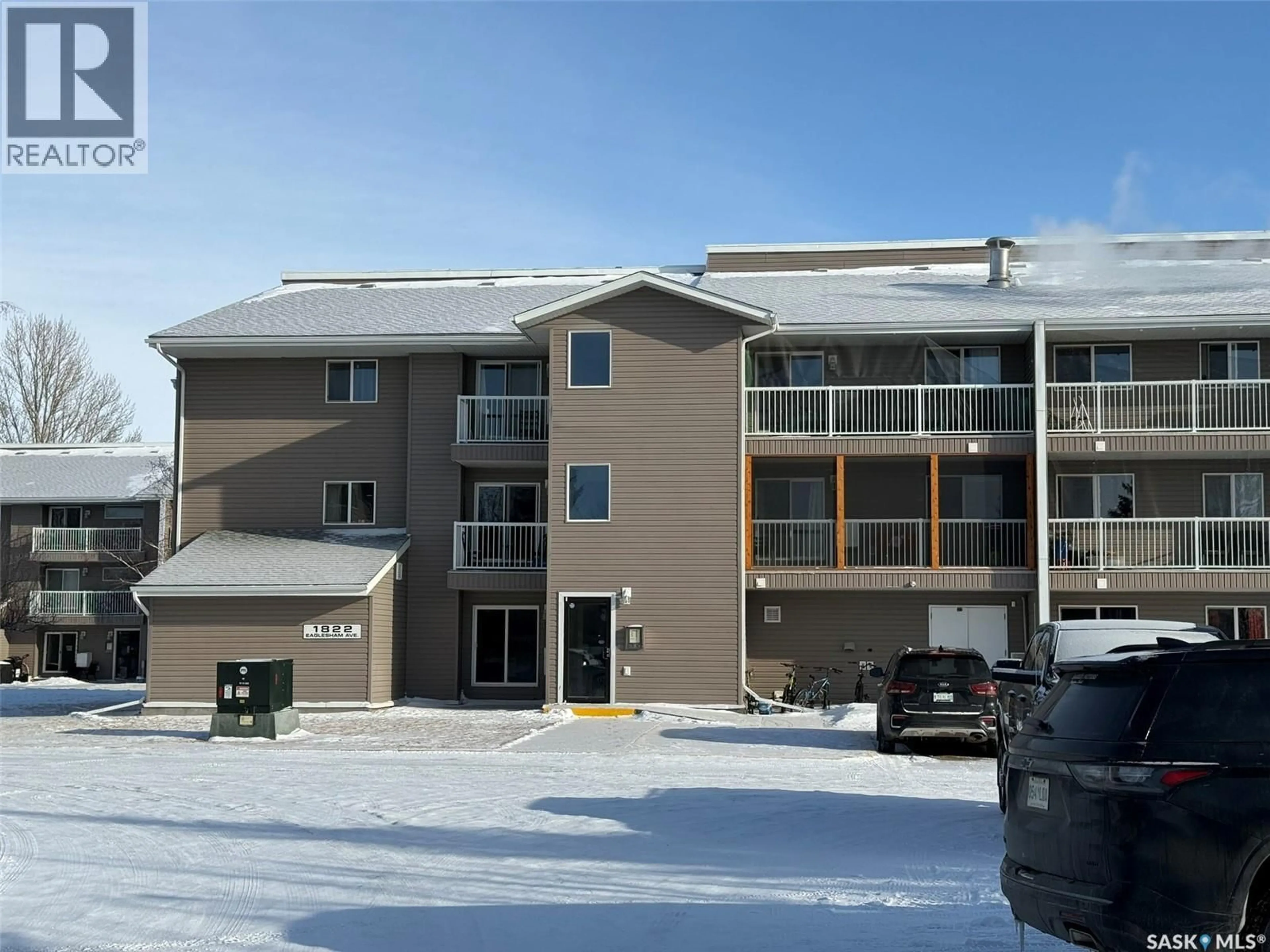 A pic from outside/outdoor area/front of a property/back of a property/a pic from drone, building for 101 - 1822 EAGLESHAM AVENUE, Weyburn Saskatchewan S4T2R1