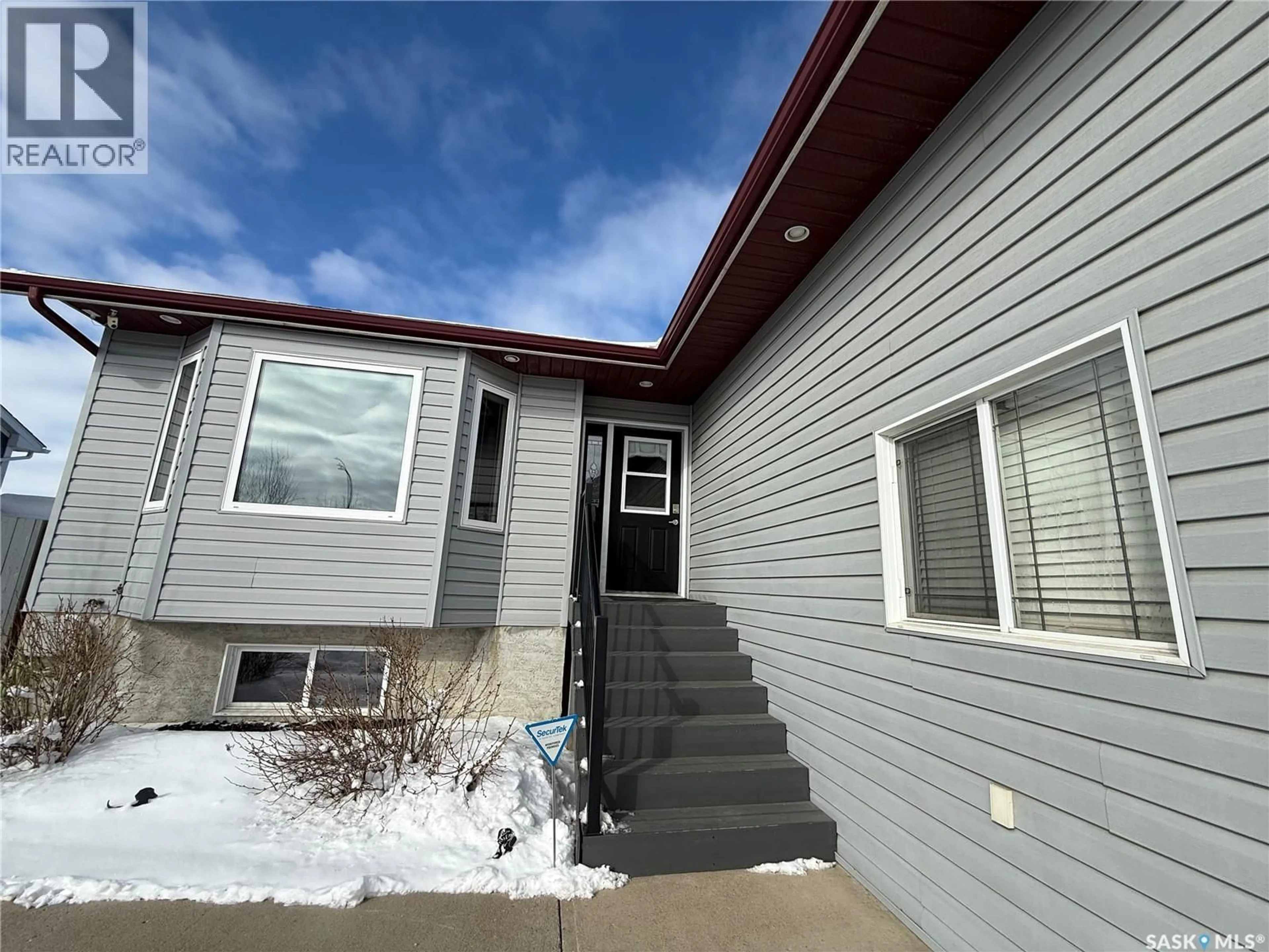 Home with vinyl exterior material, street for 327 PETTERSON DRIVE, Estevan Saskatchewan S4A0Y1