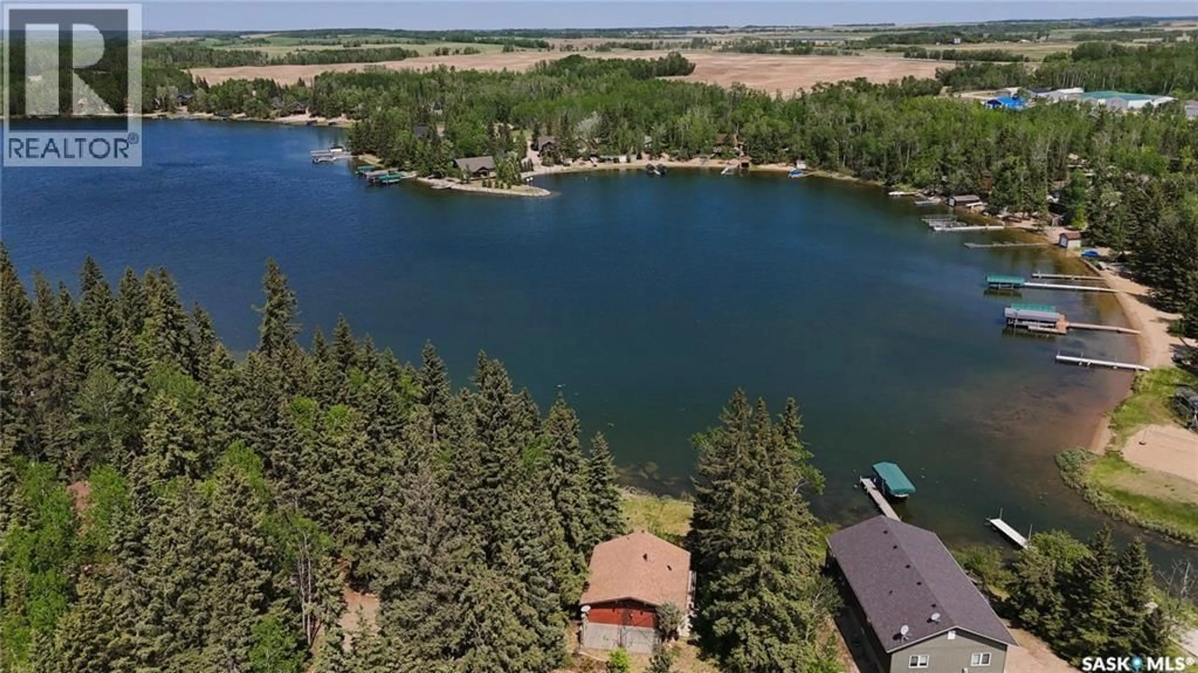 A pic from outside/outdoor area/front of a property/back of a property/a pic from drone, water/lake/river/ocean view for 102 LAKESHORE DRIVE, Echo Bay Saskatchewan S0J2G0
