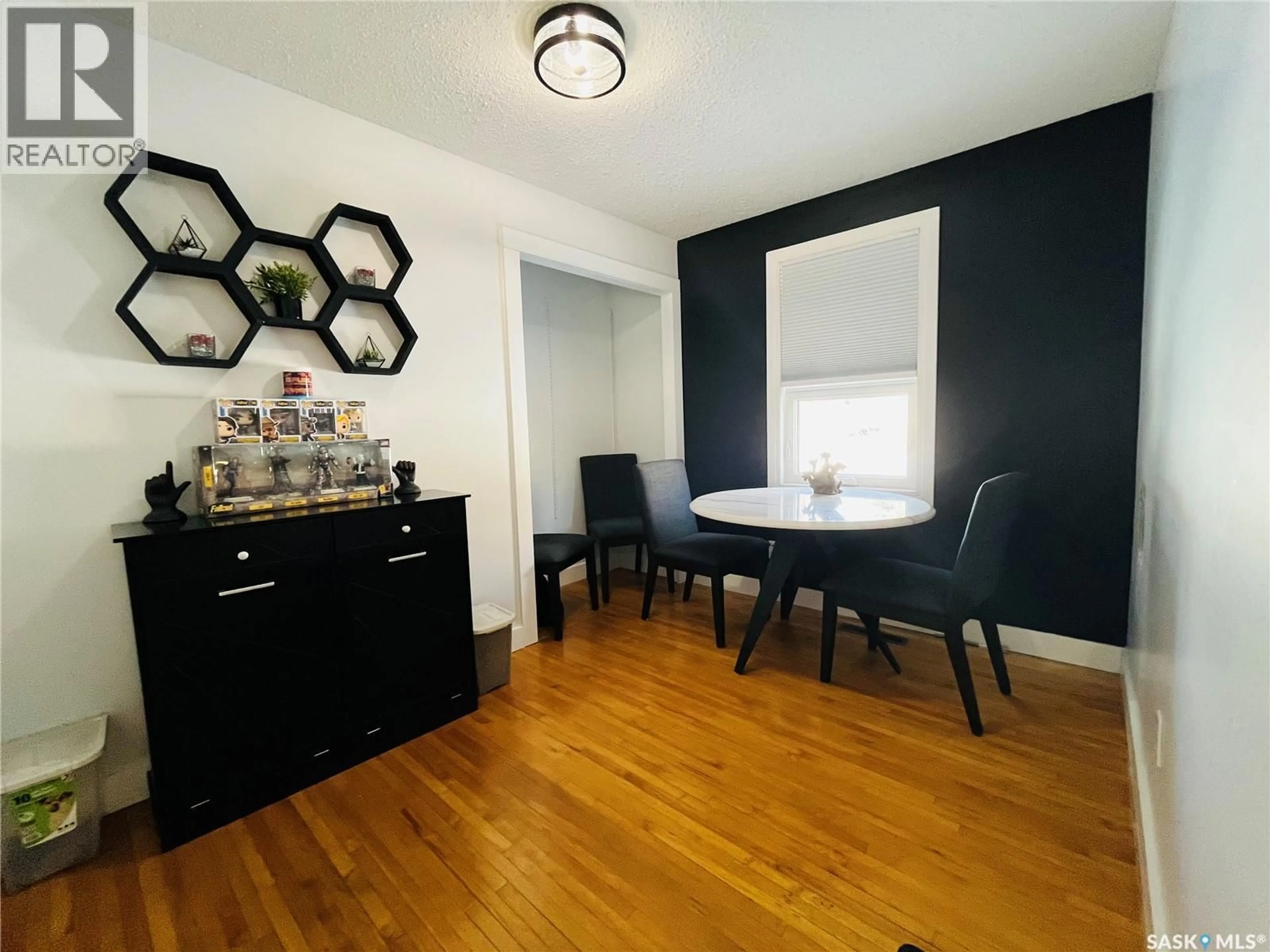 Dining room, wood/laminate floor for 45 6TH AVENUE, Swift Current Saskatchewan S9H2L8