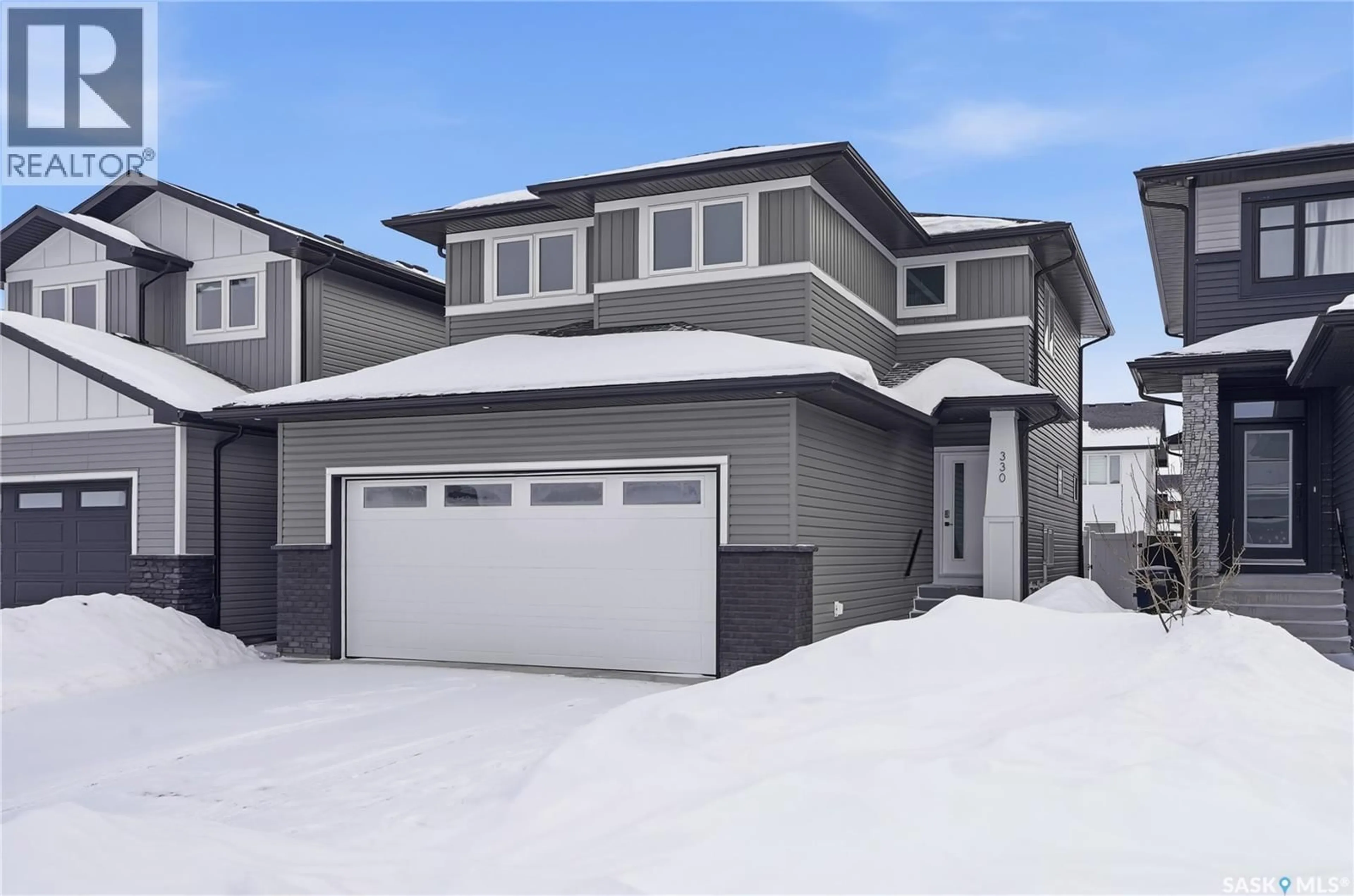 Home with vinyl exterior material, street for 330 ANISKOTAW BEND, Saskatoon Saskatchewan S7V1M1