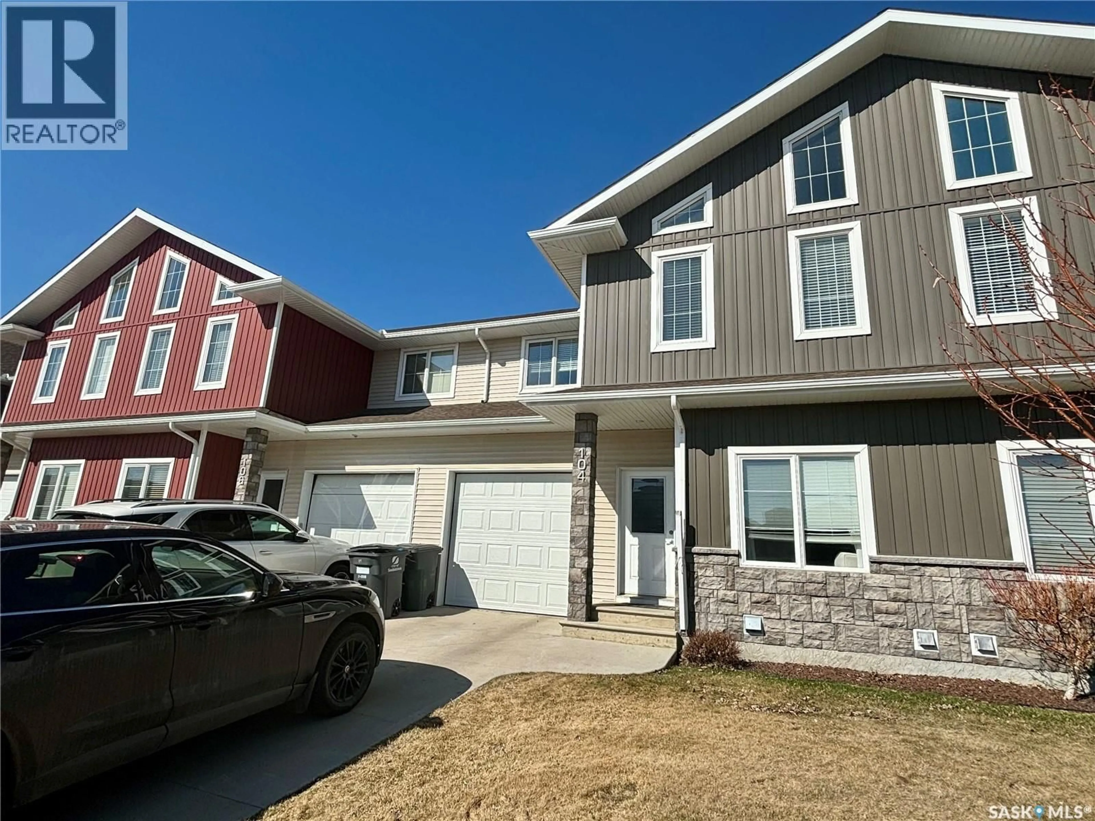 Home with vinyl exterior material, street for 104 ATTON CRESCENT, Saskatoon Saskatchewan S7W0N9