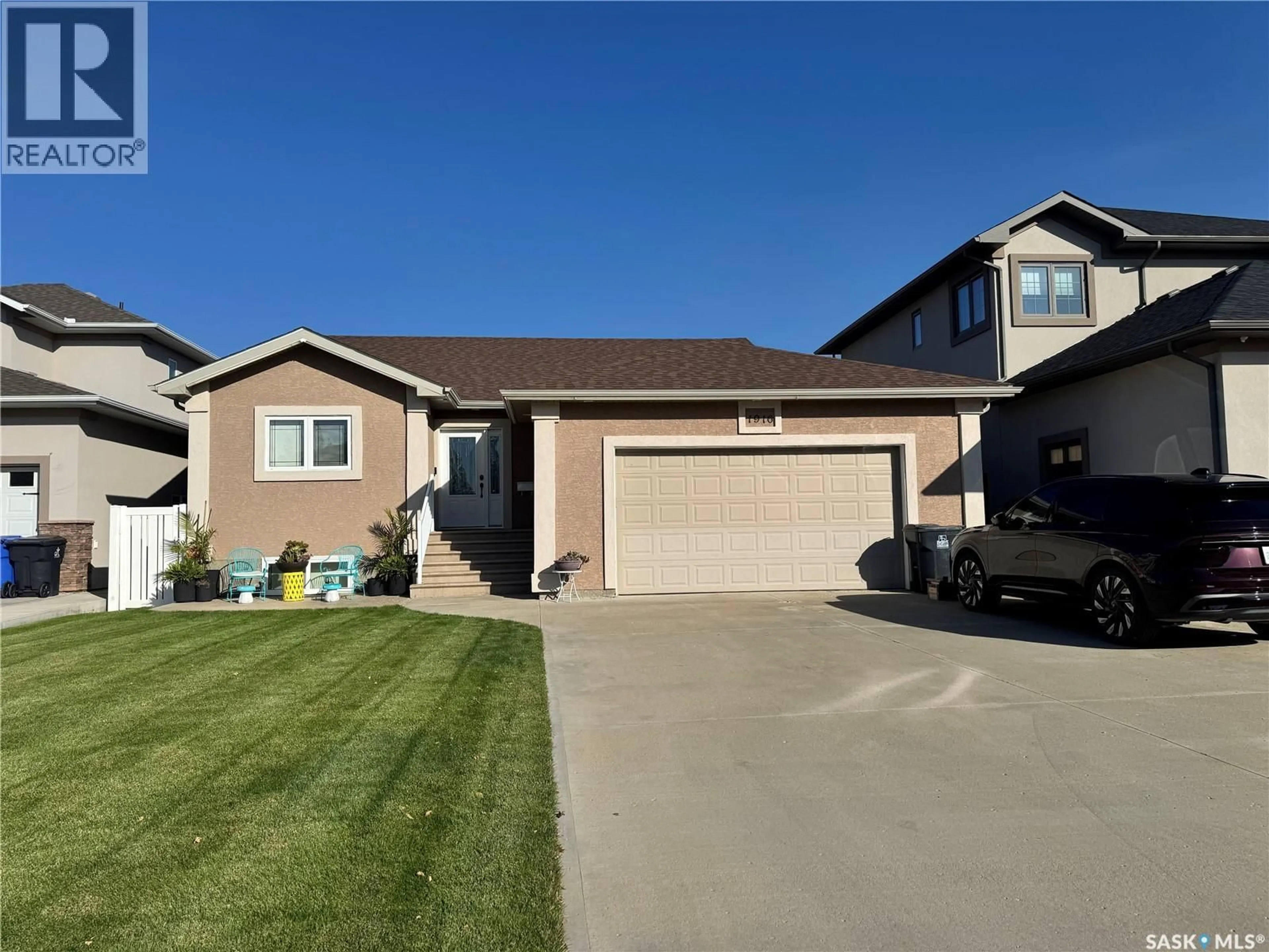 Home with vinyl exterior material, street for 1916 JESSE BAY, Estevan Saskatchewan S4A2W3