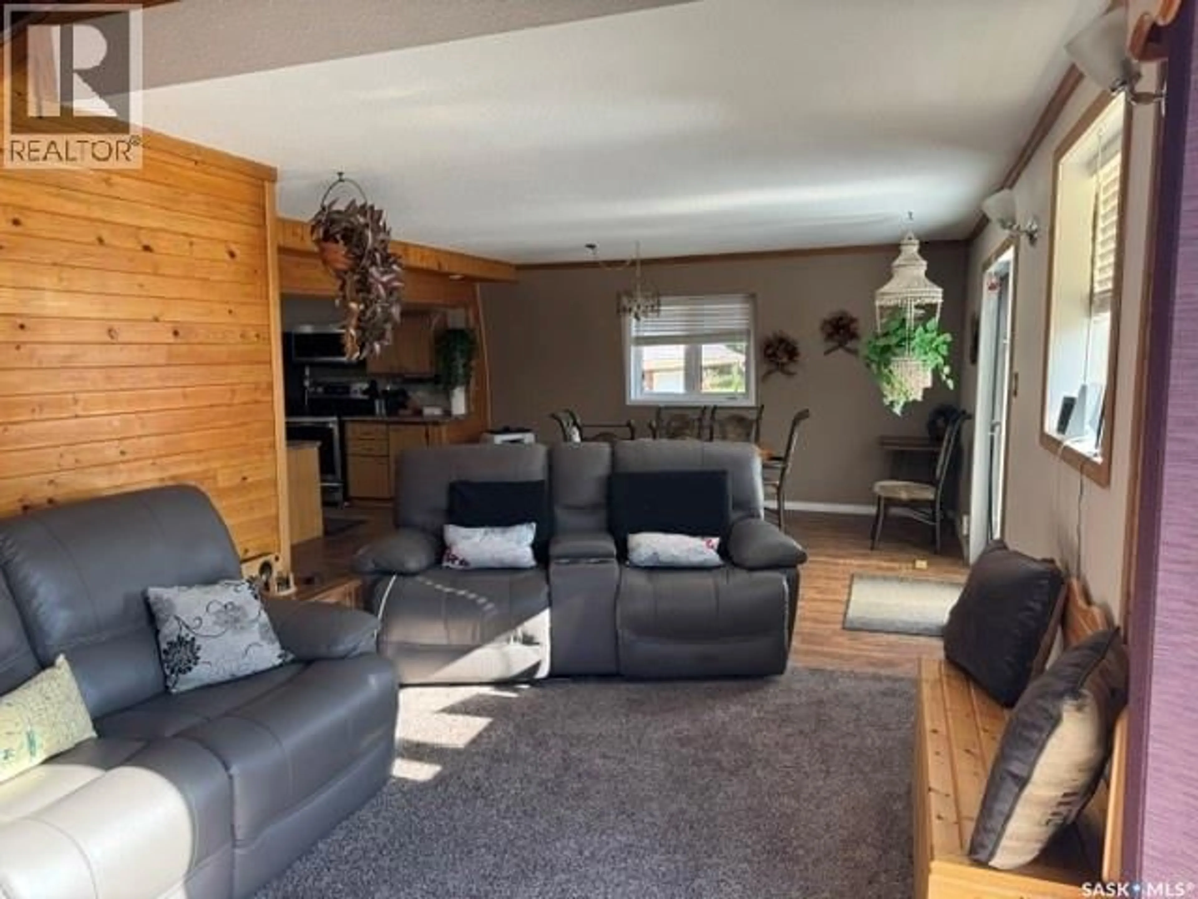 Living room with furniture, wood/laminate floor for 922 & 926 LAKESHORE DR, Turtle Lake Saskatchewan S0M1J0
