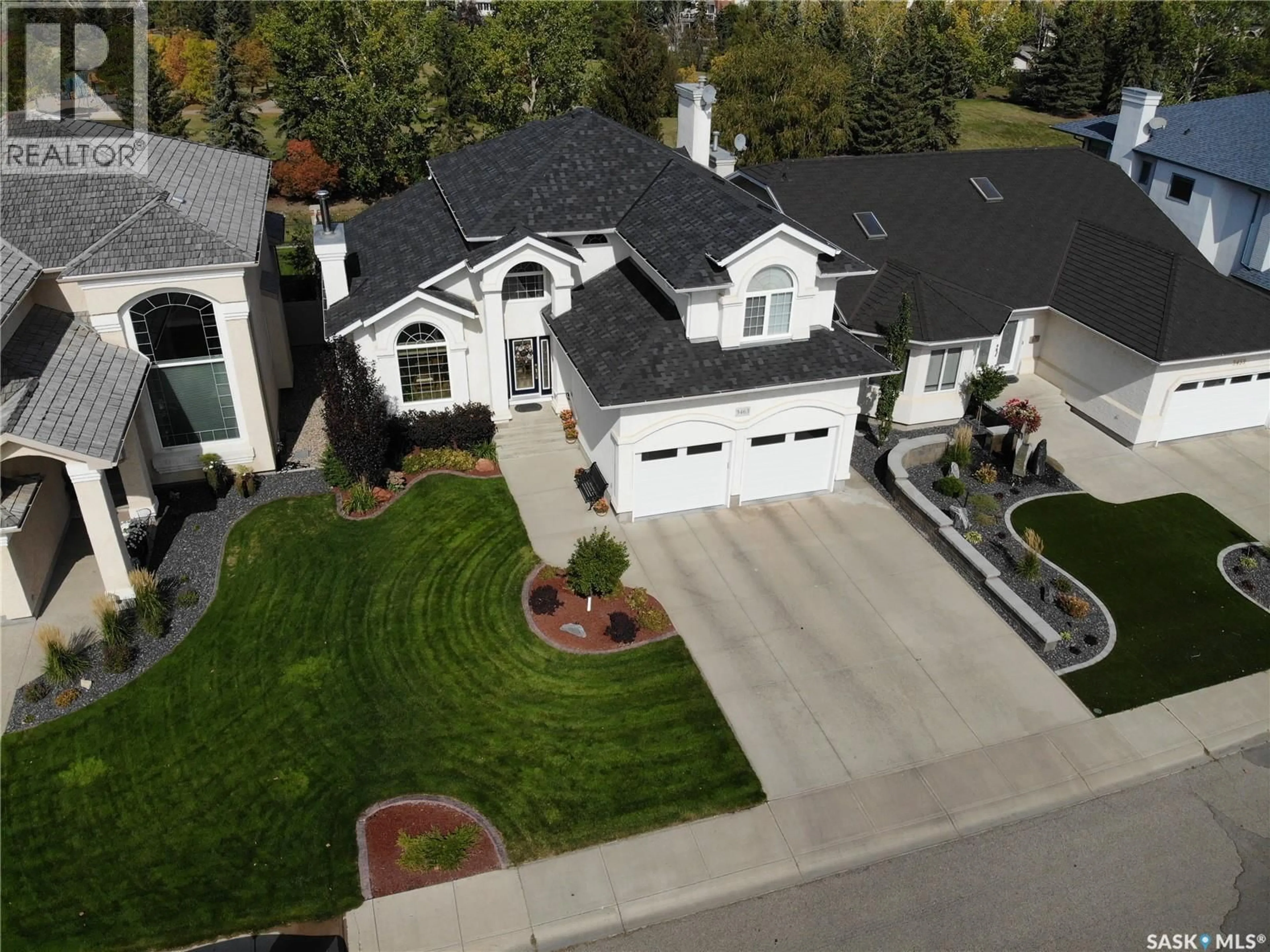 Home with vinyl exterior material, street for 9463 WASCANA MEWS, Regina Saskatchewan S4V2V5