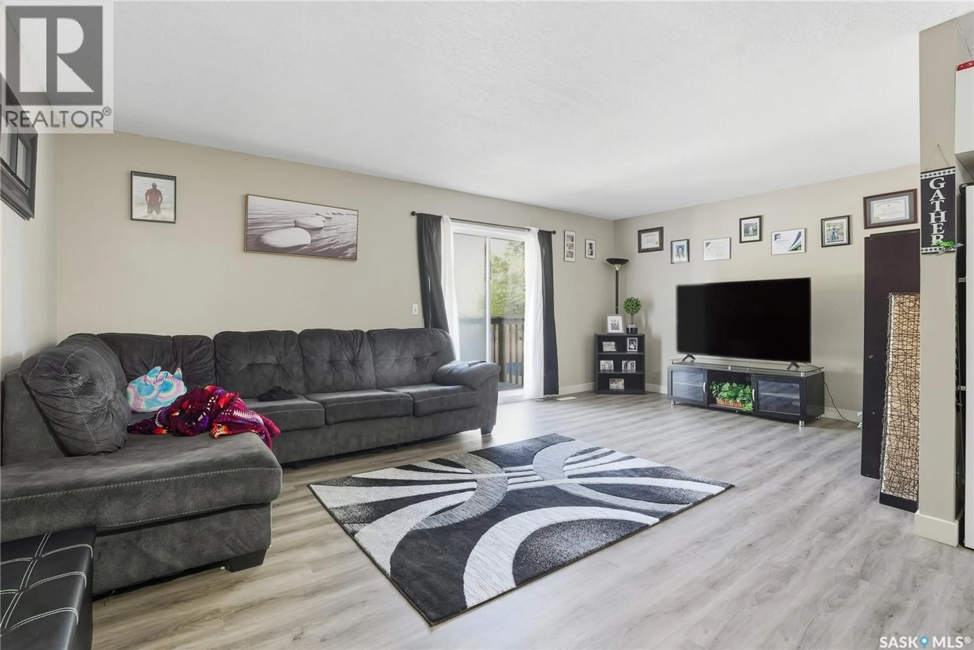 Living room with furniture, unknown for 119 - 121 OLMSTEAD ROAD, Saskatoon Saskatchewan S7M4L9