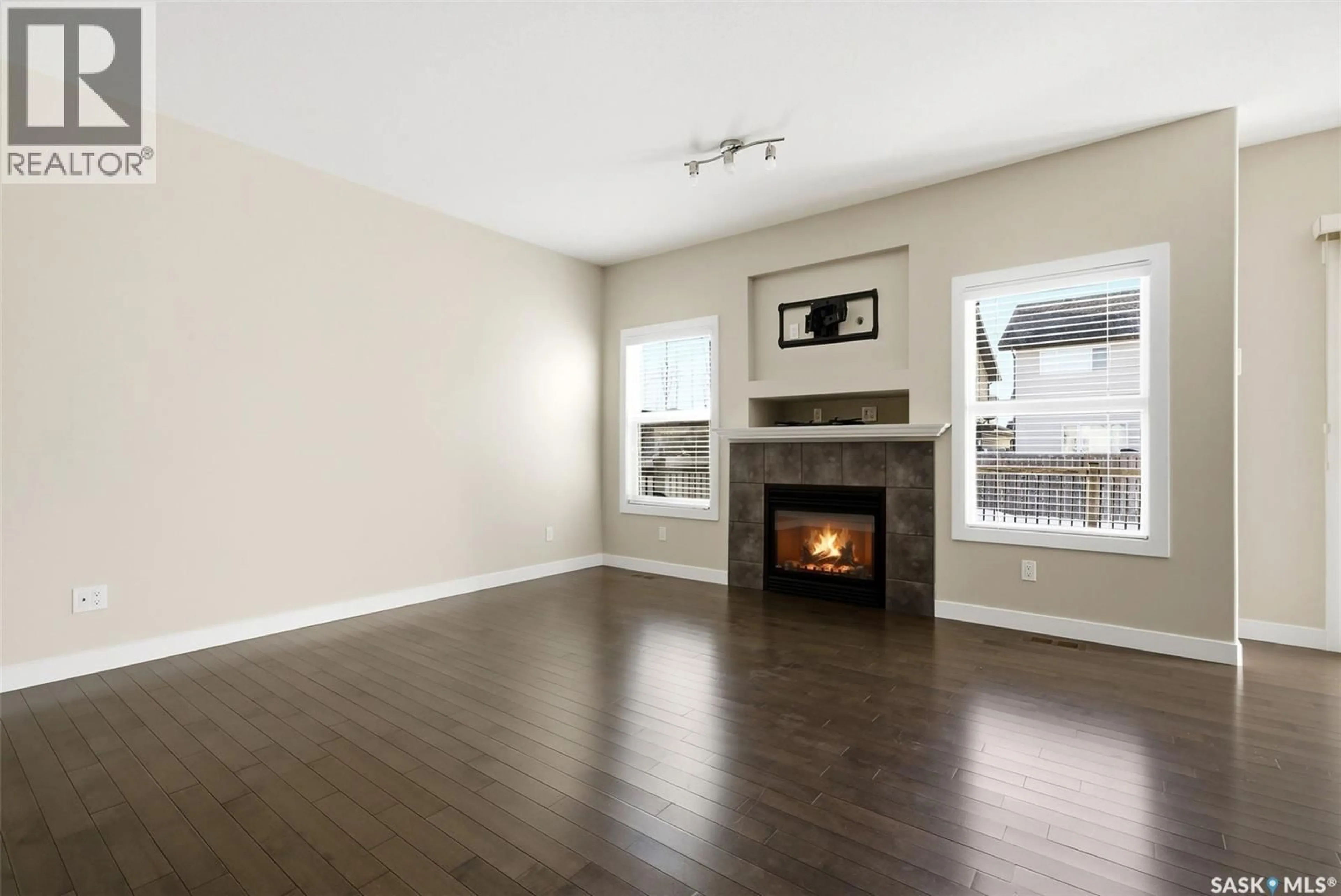 Living room with furniture, wood/laminate floor for 3105 ELGAARD DRIVE, Regina Saskatchewan S4X0K3