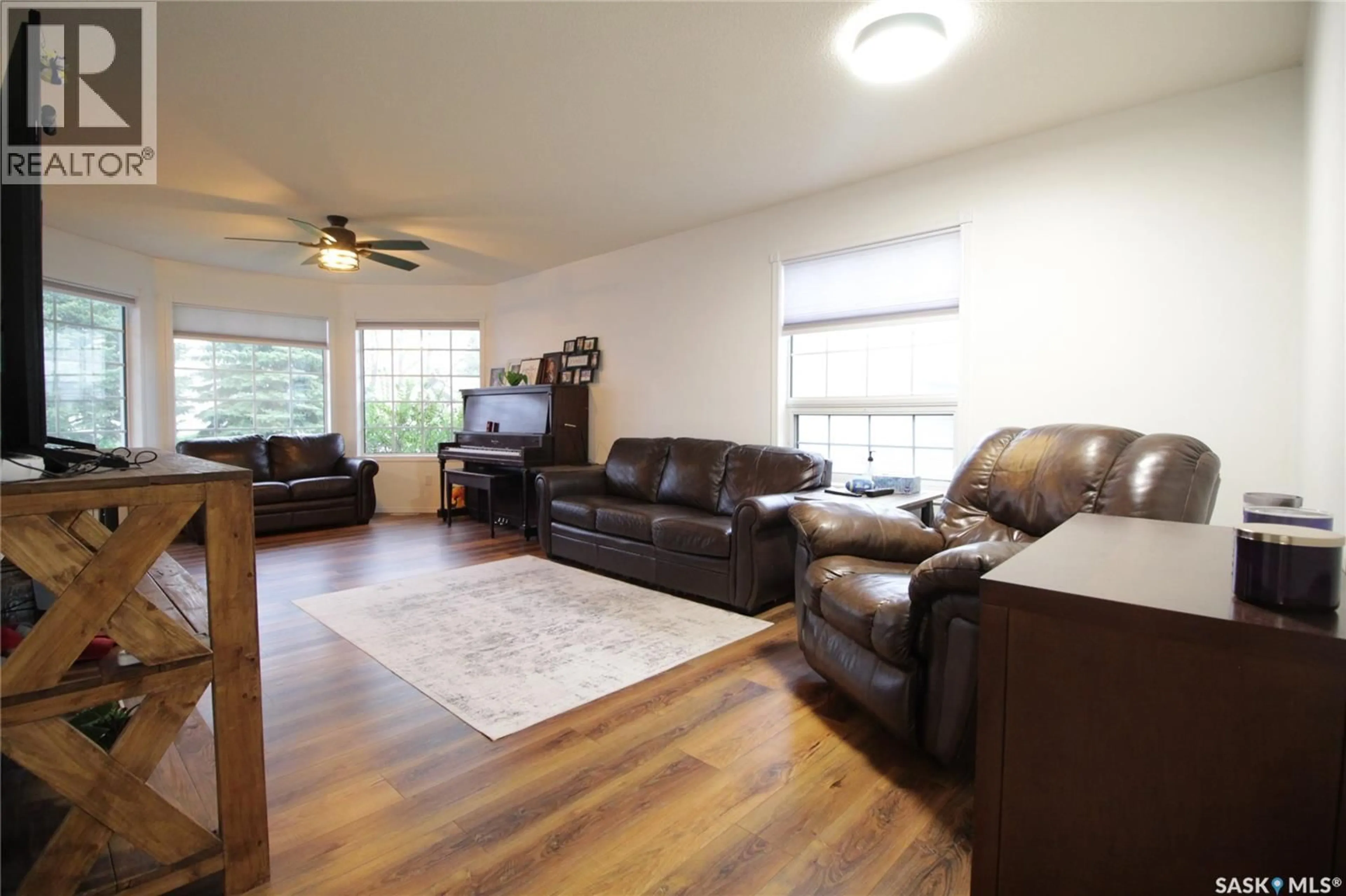 Living room with furniture, wood/laminate floor for 538 COOK ROAD, Moosomin Saskatchewan S0G3N0