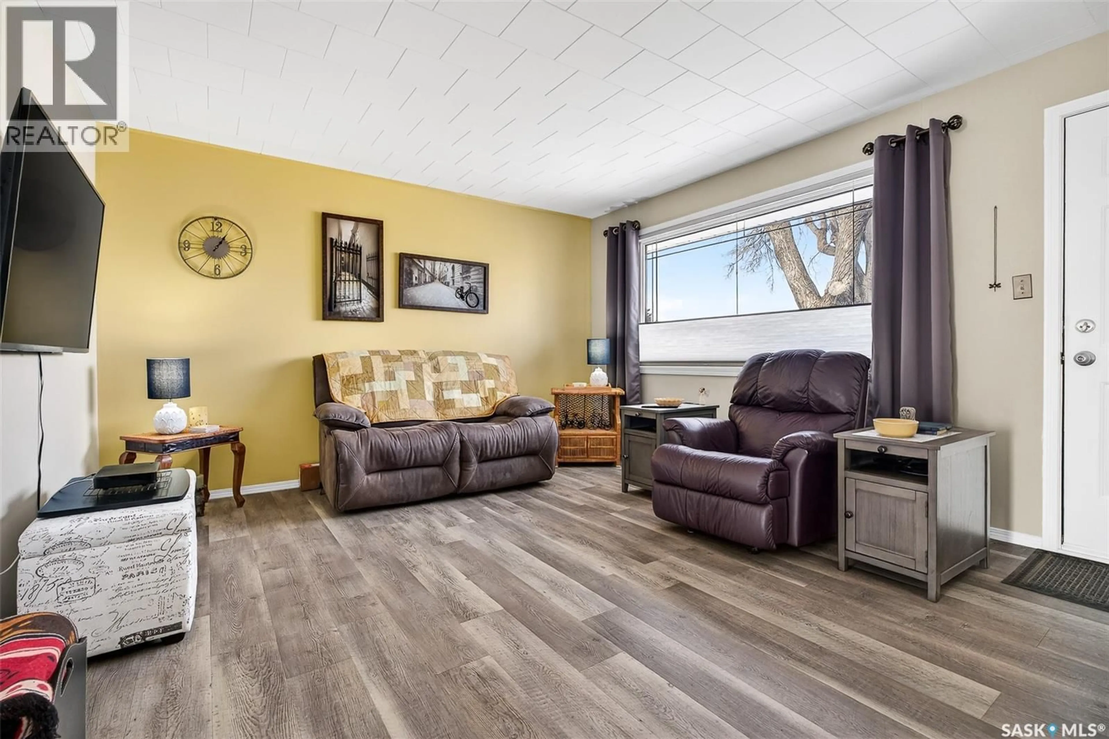 Living room with furniture, wood/laminate floor for 1239 DUFFIELD STREET, Moose Jaw Saskatchewan S6H5K2