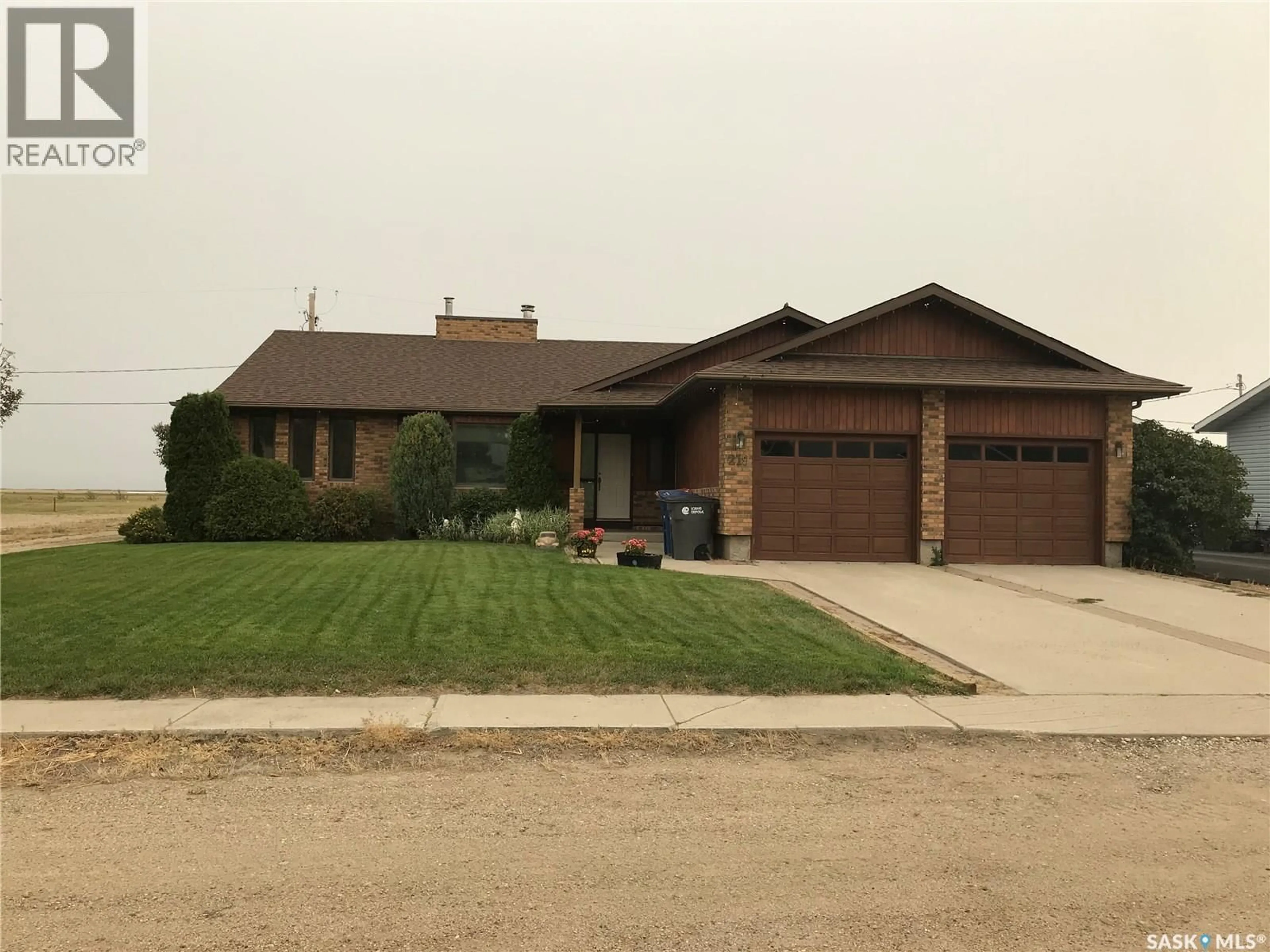 Home with brick exterior material, street for 219 3RD STREET, Odessa Saskatchewan S0G3S0