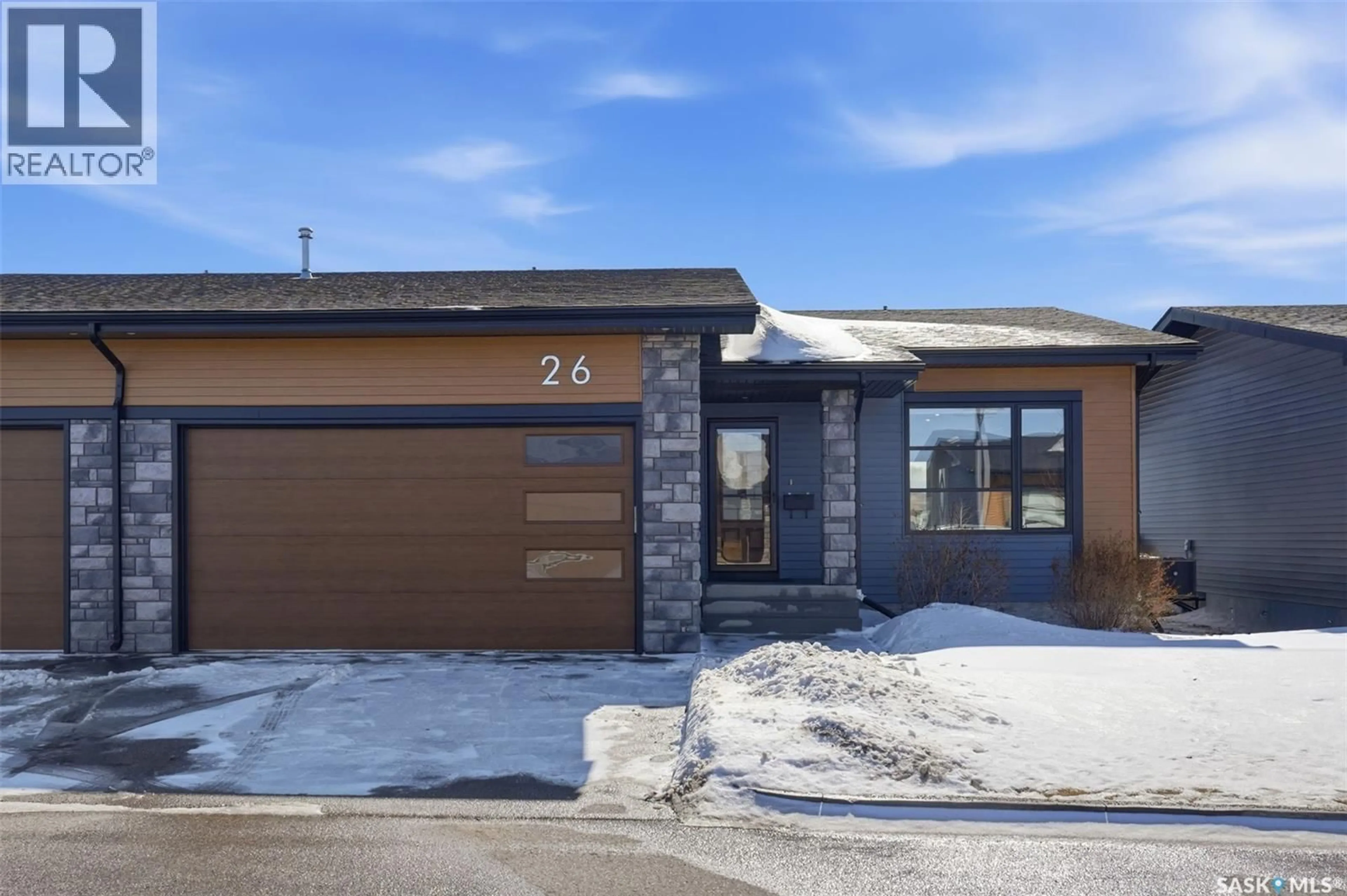 Home with brick exterior material, street for 103 - 26 POHORECKY CRESCENT, Saskatoon Saskatchewan S7W0X6