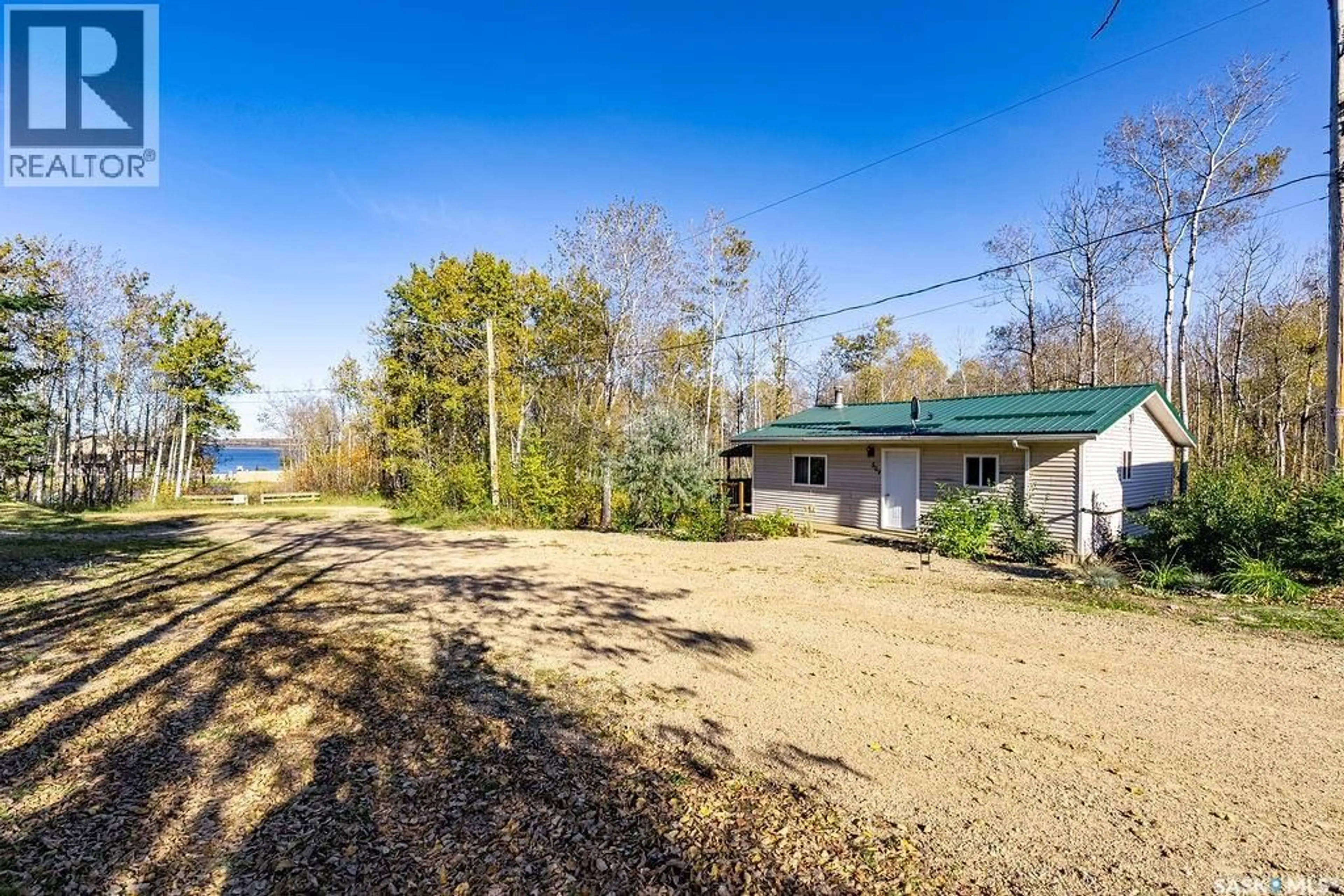 A pic from outside/outdoor area/front of a property/back of a property/a pic from drone, water/lake/river/ocean view for 509 POPLAR CRESCENT, Iroquois Lake Saskatchewan S0J1M0