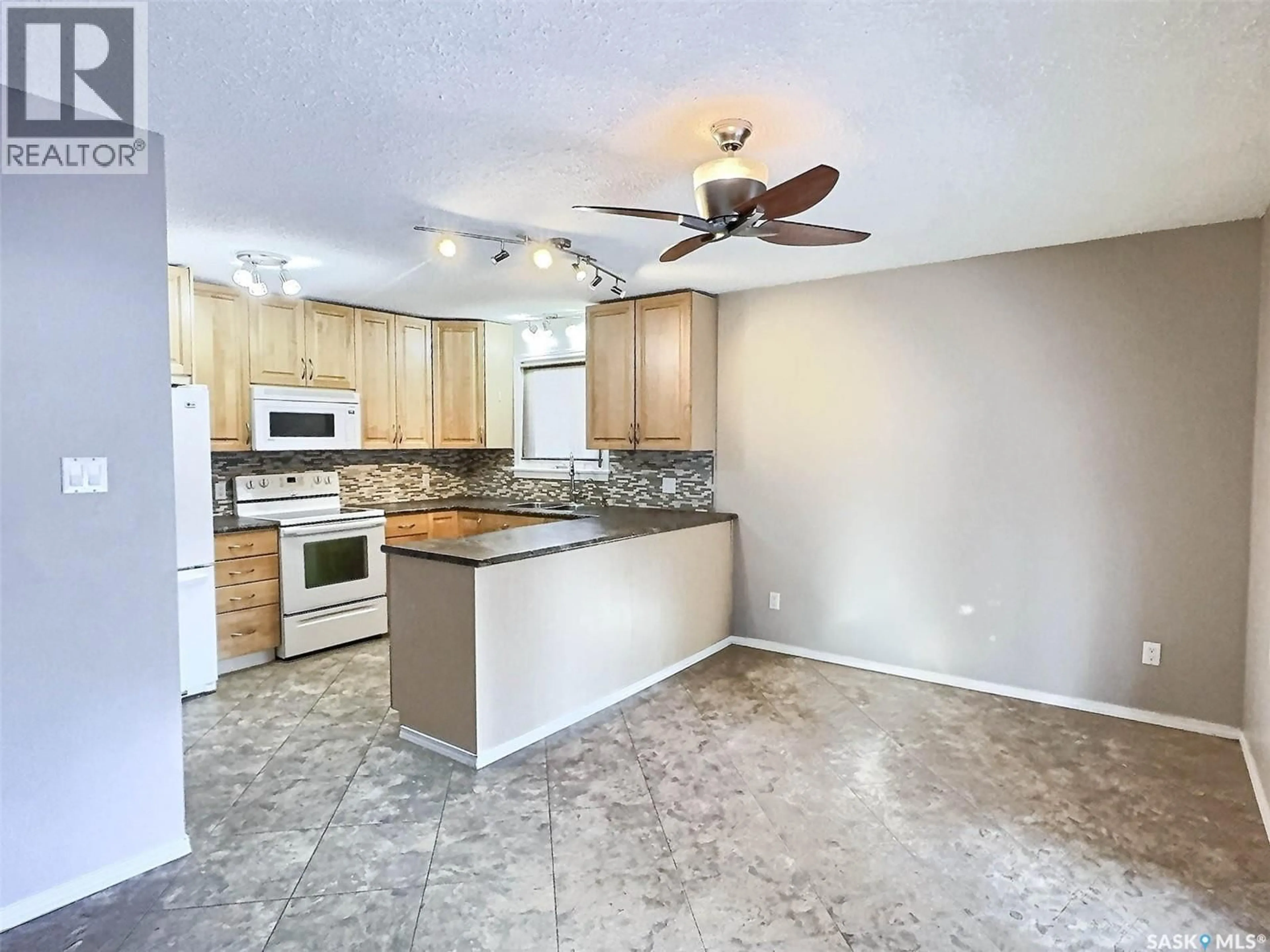 Open concept kitchen, ceramic/tile floor for 2881 WYLLIE CRESCENT, Prince Albert Saskatchewan S6V6M3