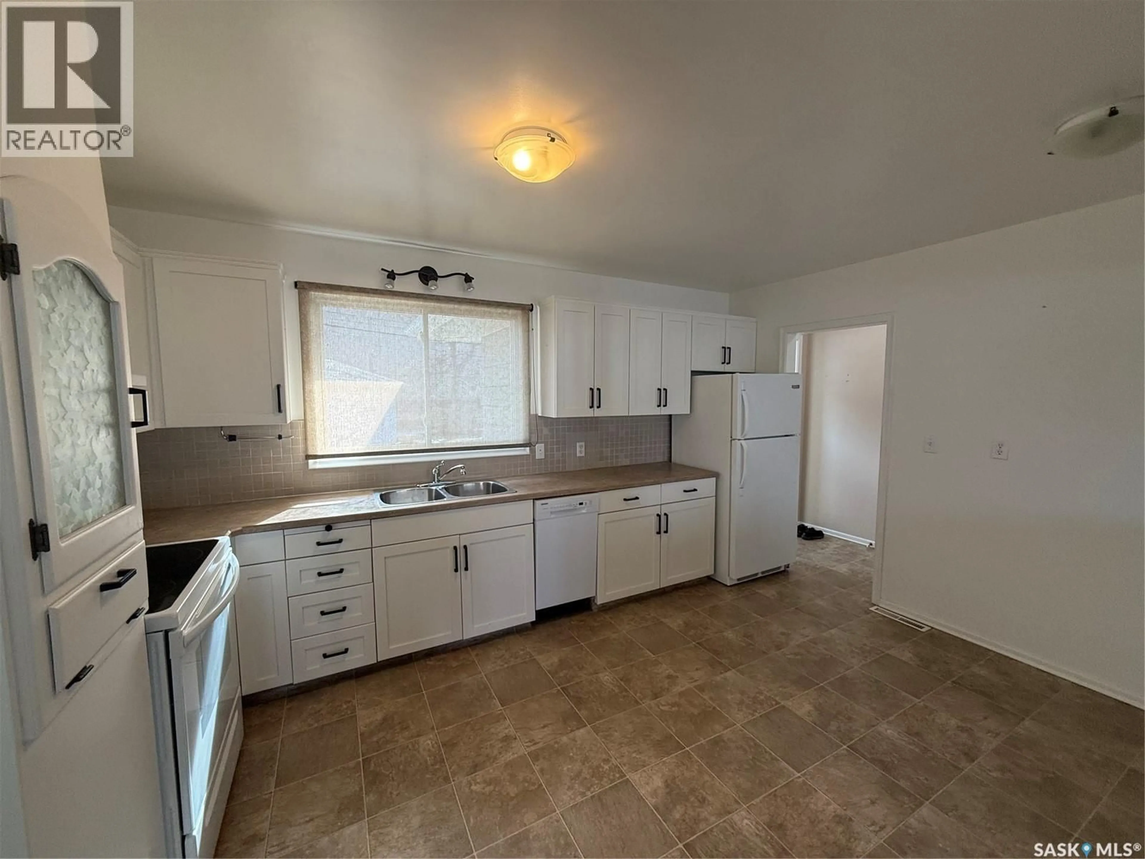 Standard kitchen, ceramic/tile floor for 302 3RD AVENUE, Assiniboia Saskatchewan S0H0B0