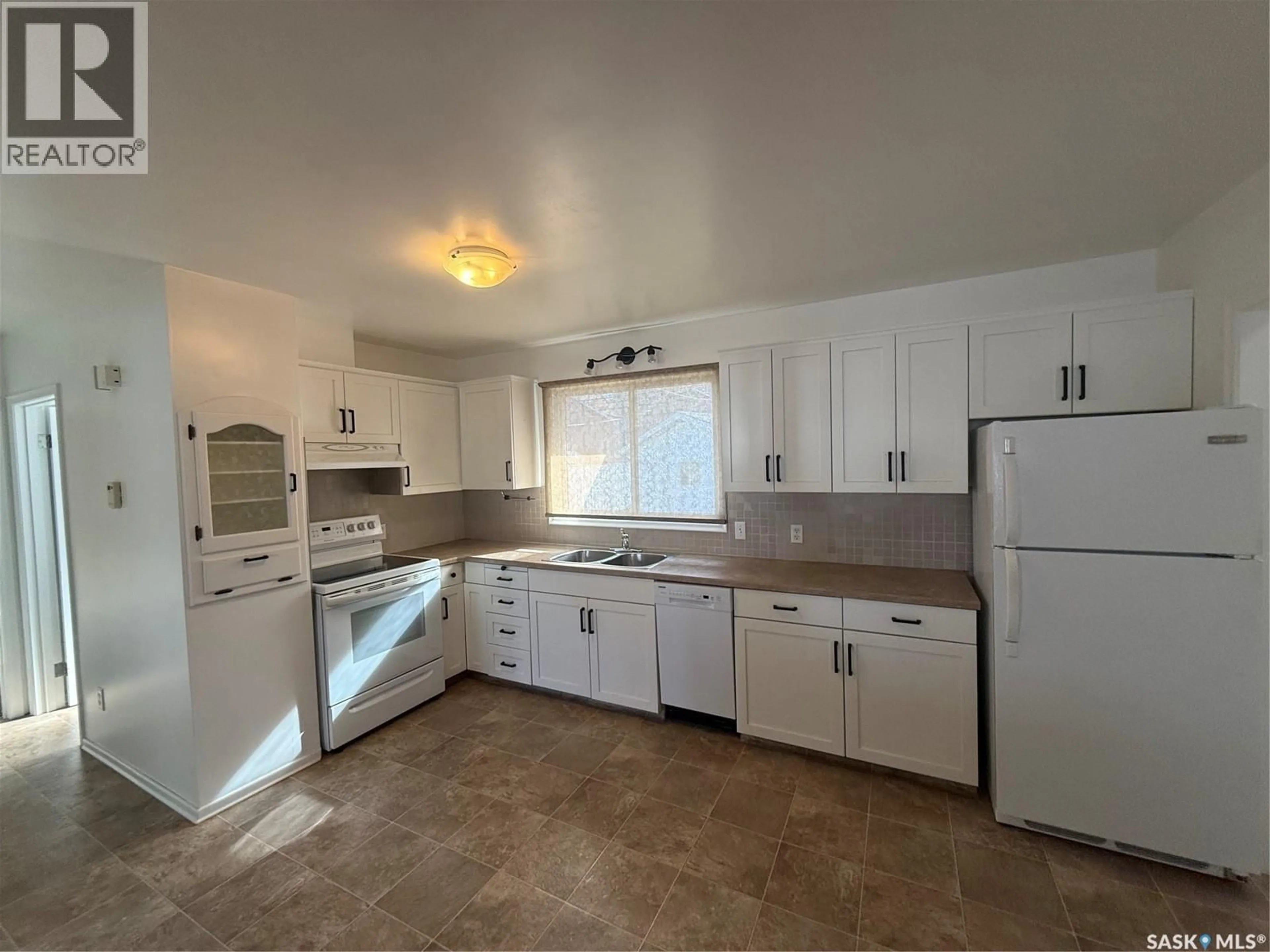 Standard kitchen, ceramic/tile floor for 302 3RD AVENUE, Assiniboia Saskatchewan S0H0B0