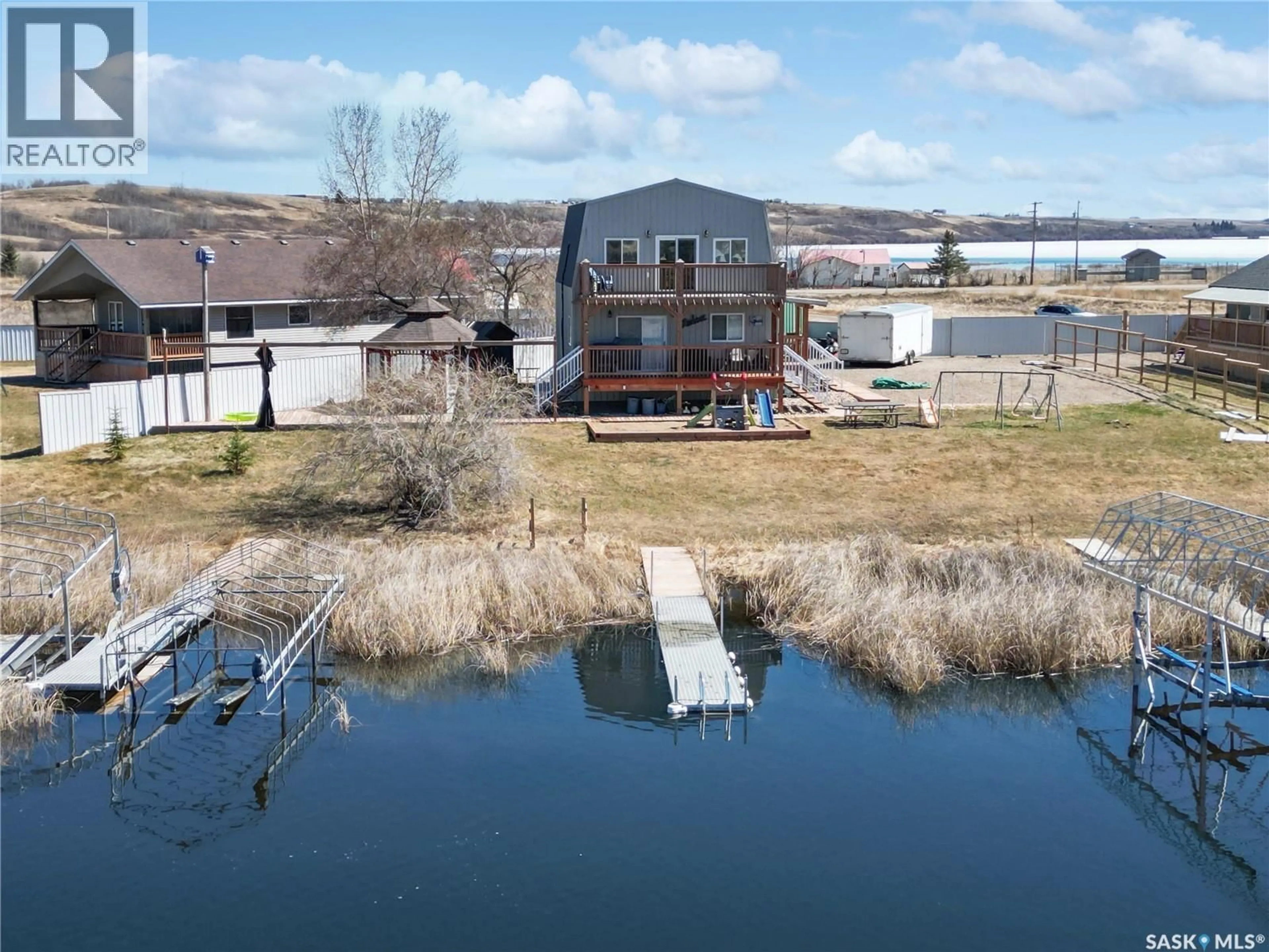A pic from outside/outdoor area/front of a property/back of a property/a pic from drone, water/lake/river/ocean view for 130 MCLENNAN DRIVE, Cochin Saskatchewan S0M0L0