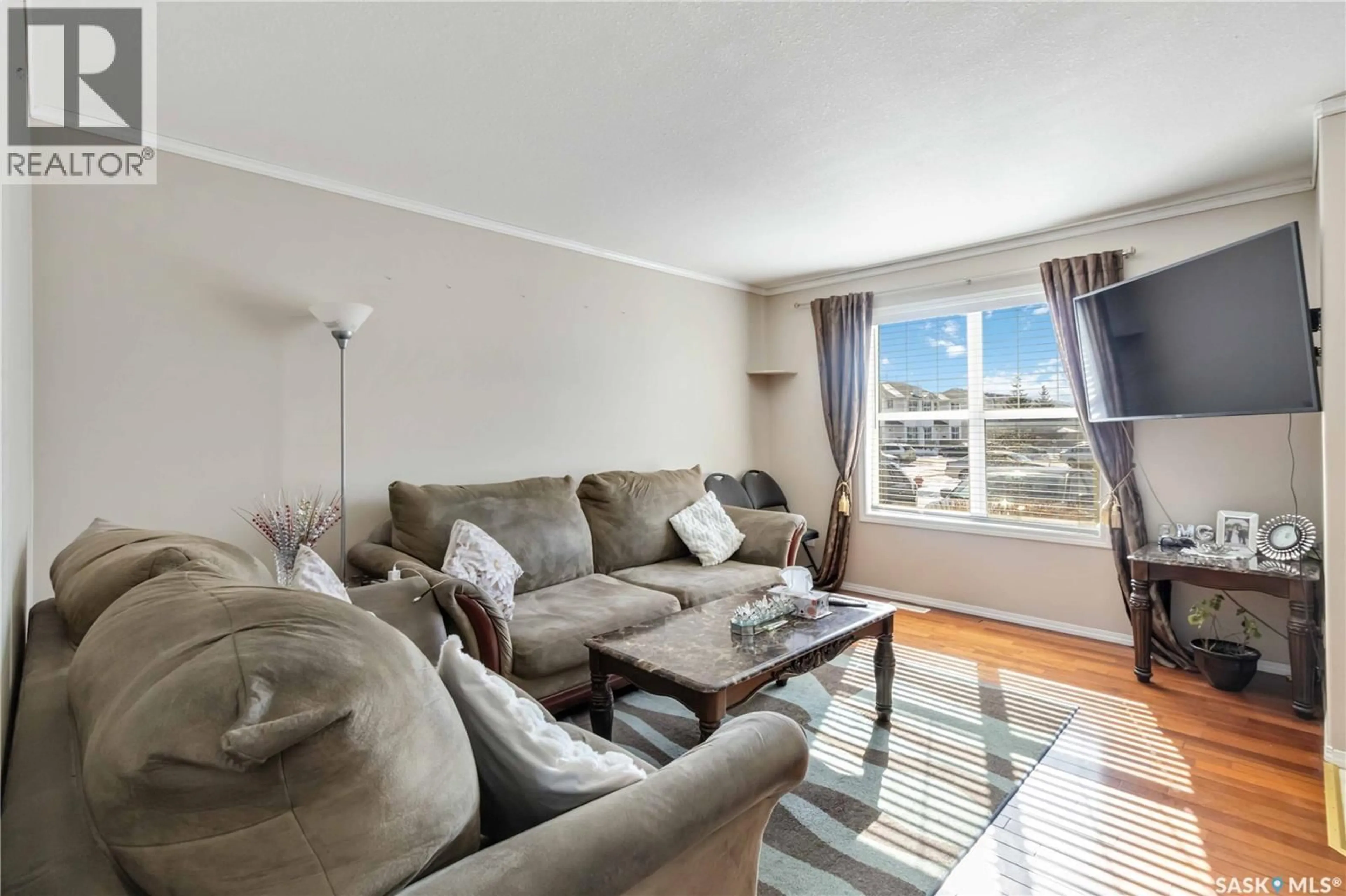 Living room with furniture, unknown for 203 - 54 HEROLD TERRACE, Saskatoon Saskatchewan S7V1H3