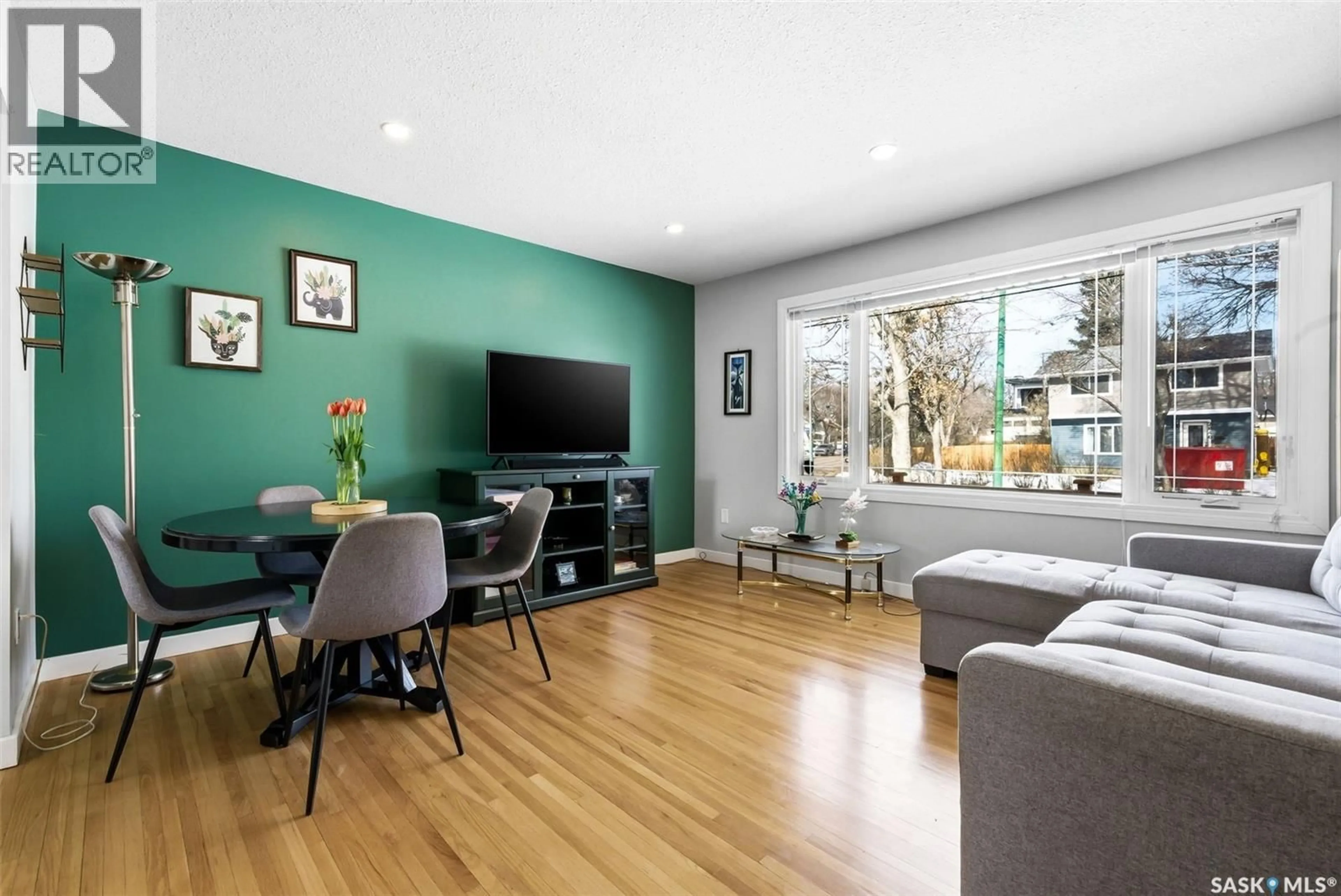 Living room with furniture, wood/laminate floor for 2839 24TH AVENUE, Regina Saskatchewan S4S1J7