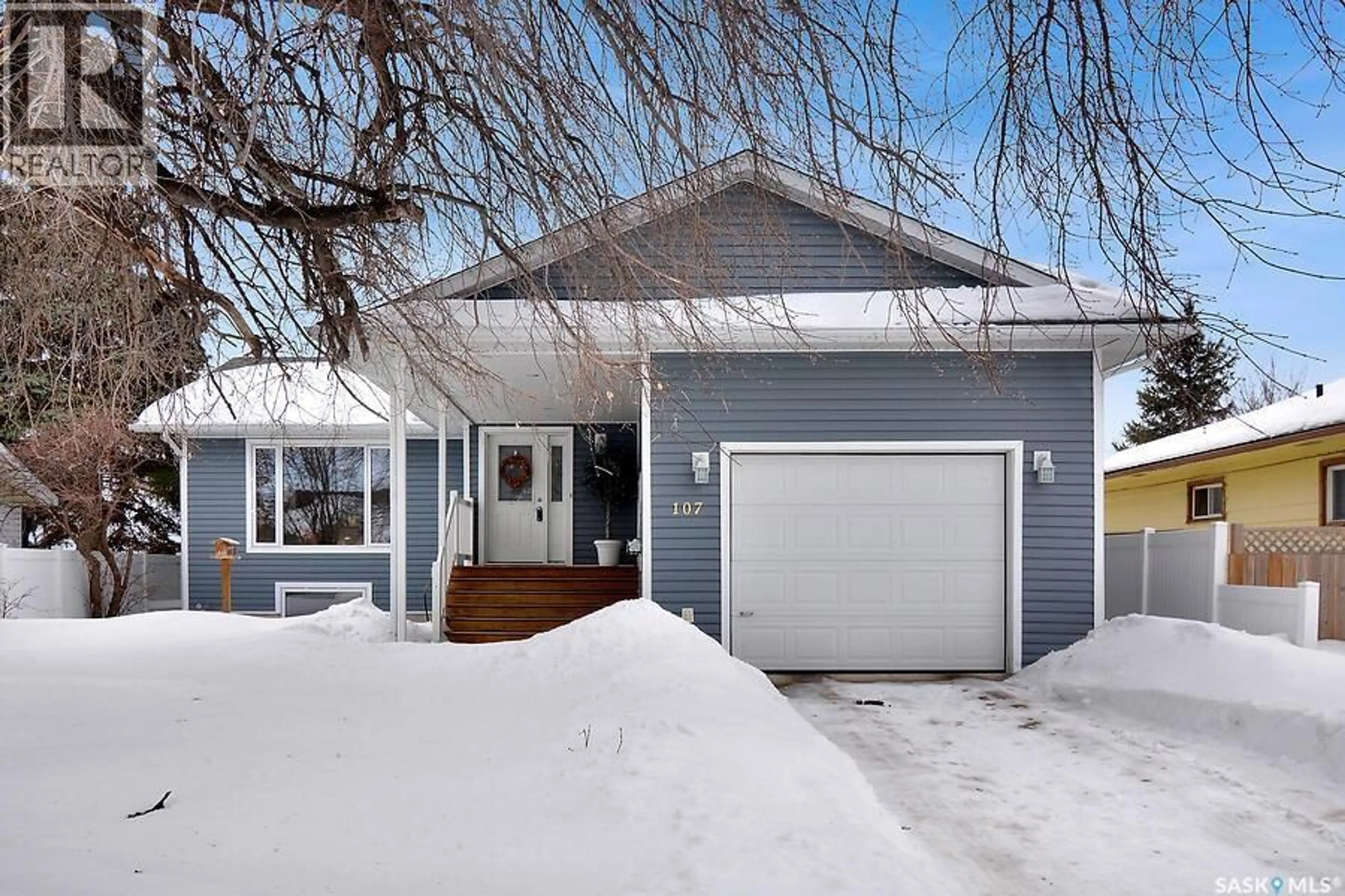 Home with vinyl exterior material, street for 107 3RD STREET, Wakaw Saskatchewan S0K4P0