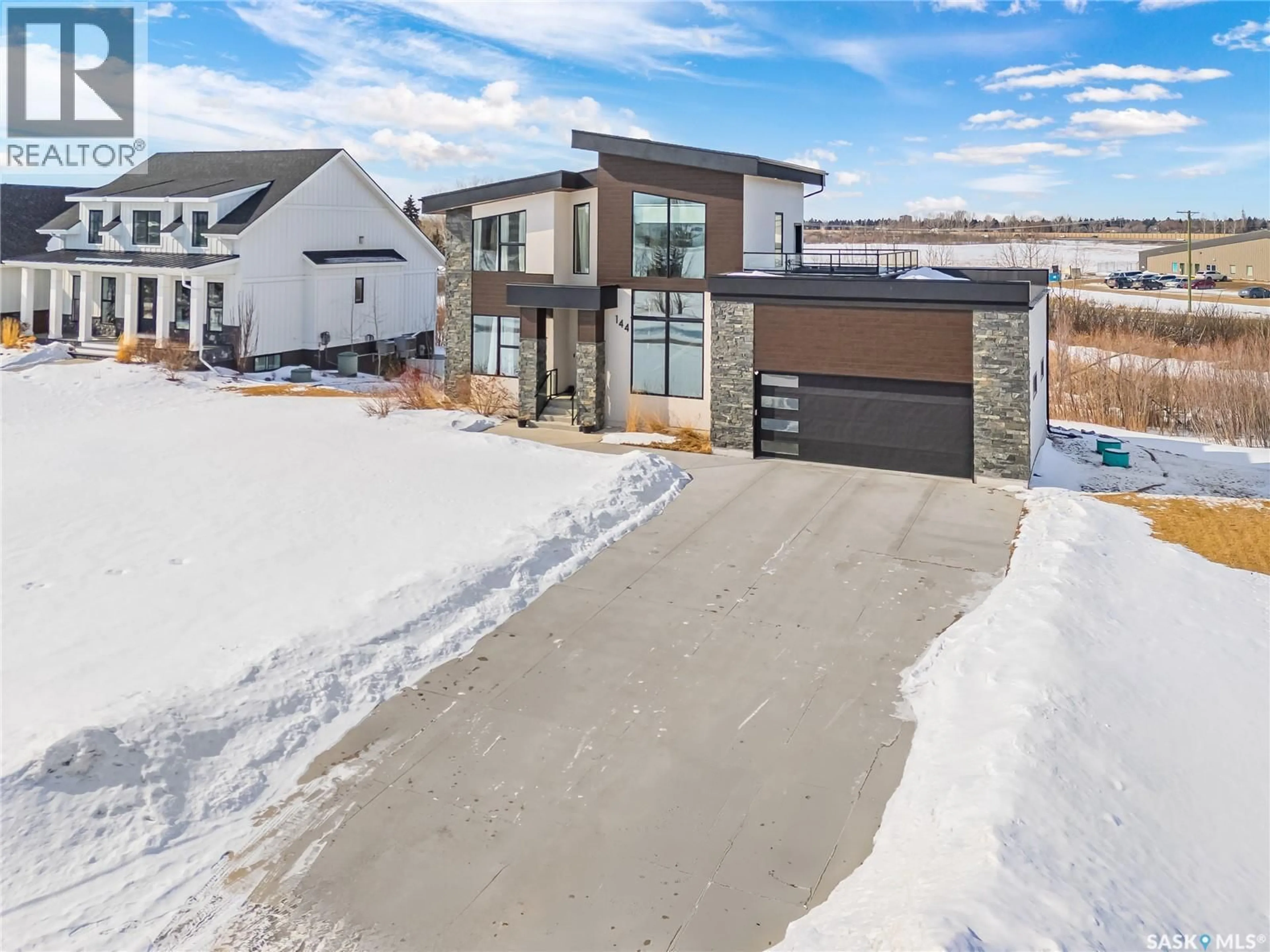 A pic from outside/outdoor area/front of a property/back of a property/a pic from drone, street for 144 GREENBRYRE STREET, Corman Park Rm No. 344 Saskatchewan S7V0J6