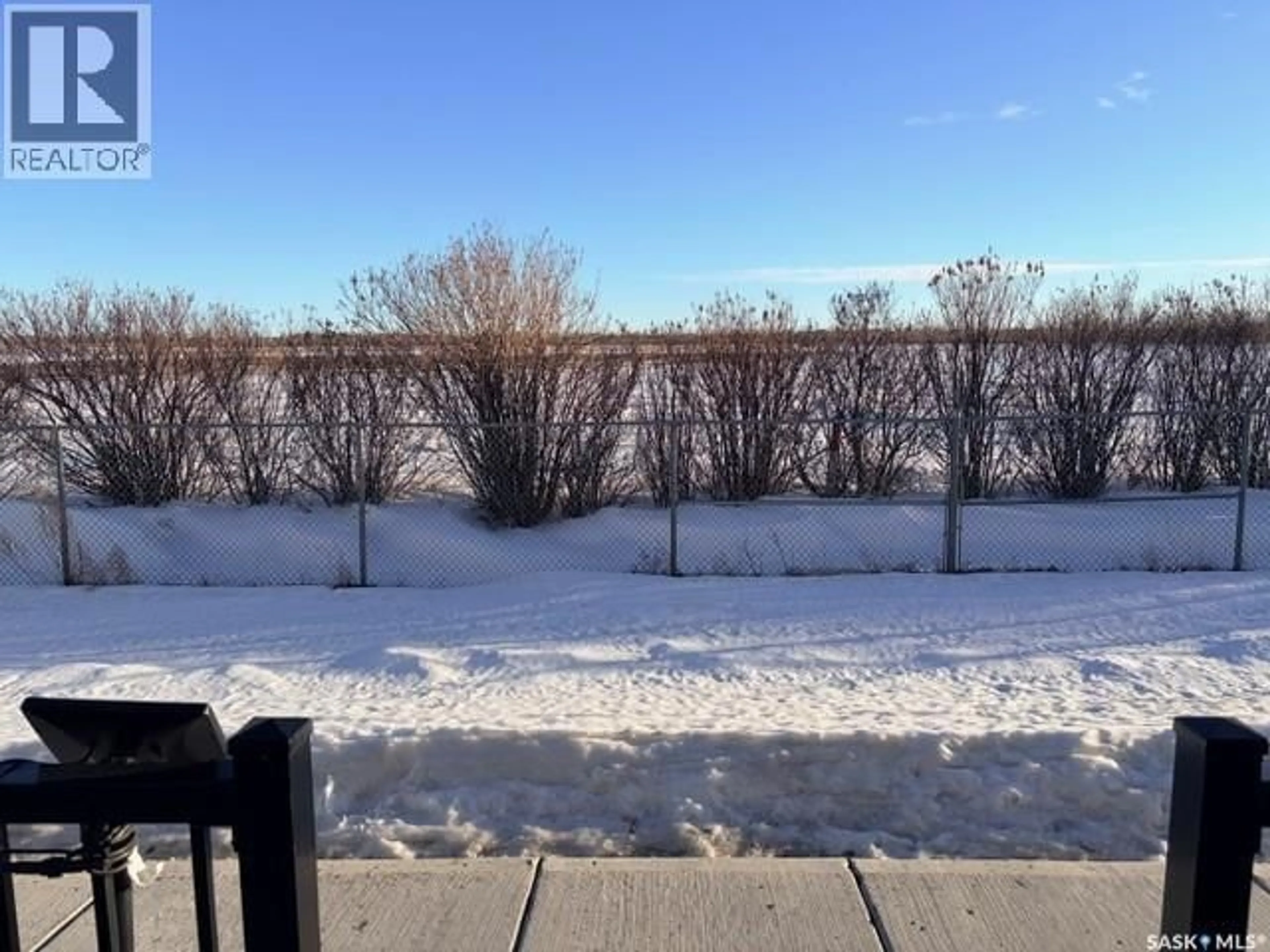 A pic from outside/outdoor area/front of a property/back of a property/a pic from drone, water/lake/river/ocean view for 303 110 AKHTAR BEND, Saskatoon Saskatchewan S7W0X5