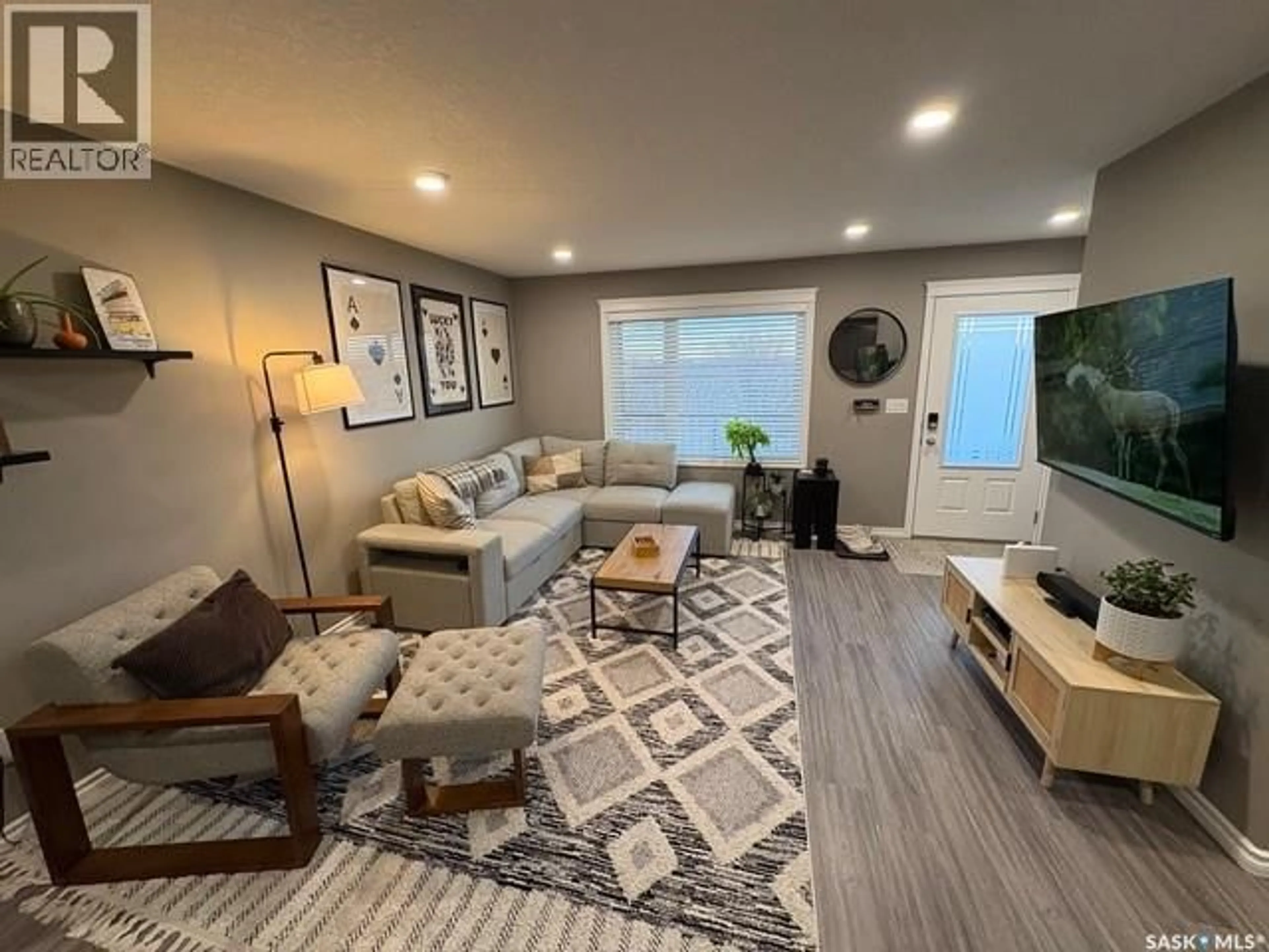 Living room with furniture, unknown for 303 110 AKHTAR BEND, Saskatoon Saskatchewan S7W0X5