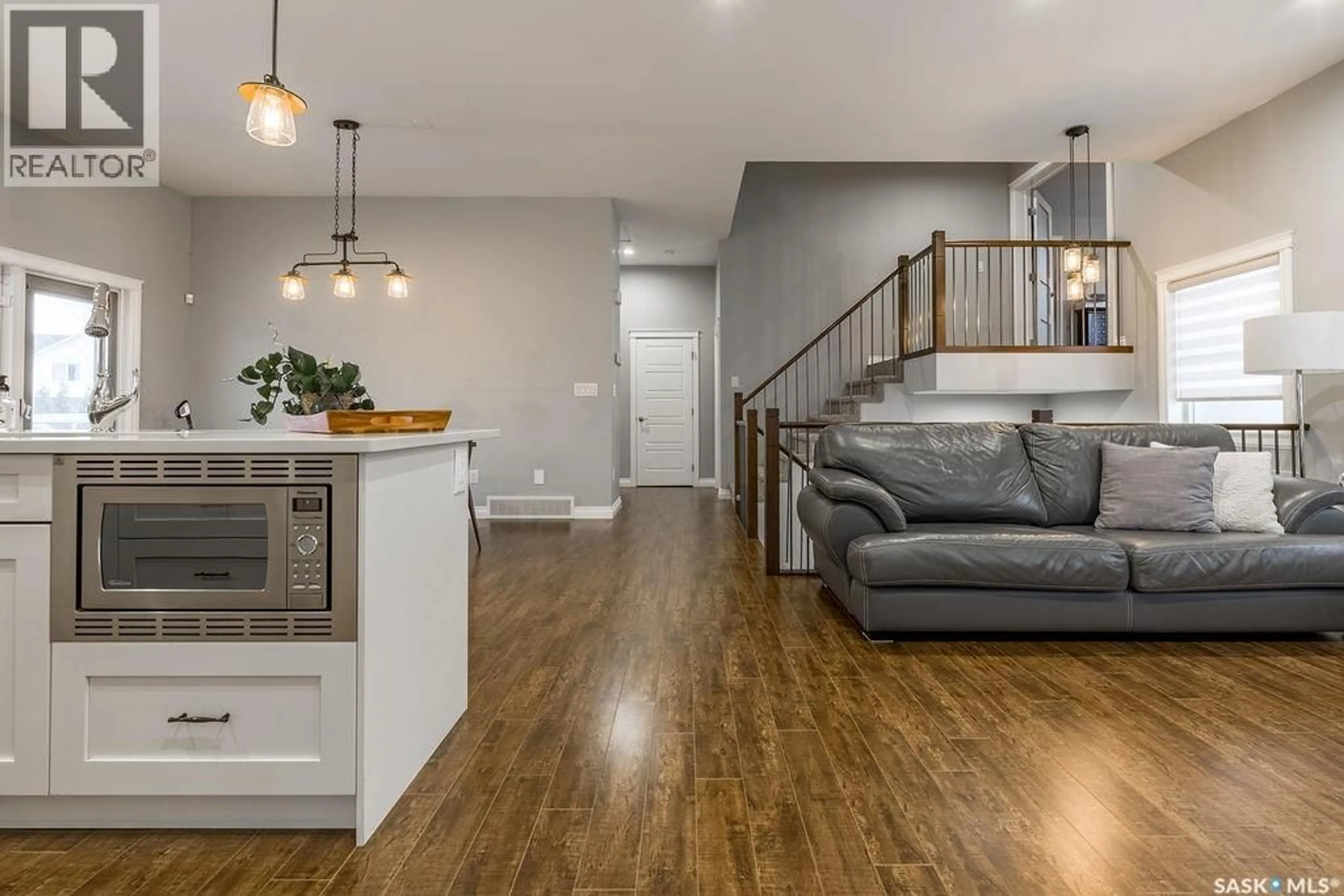 Open concept kitchen, wood/laminate floor for 602 KLOPPENBURG TERRACE, Saskatoon Saskatchewan S7W0P1