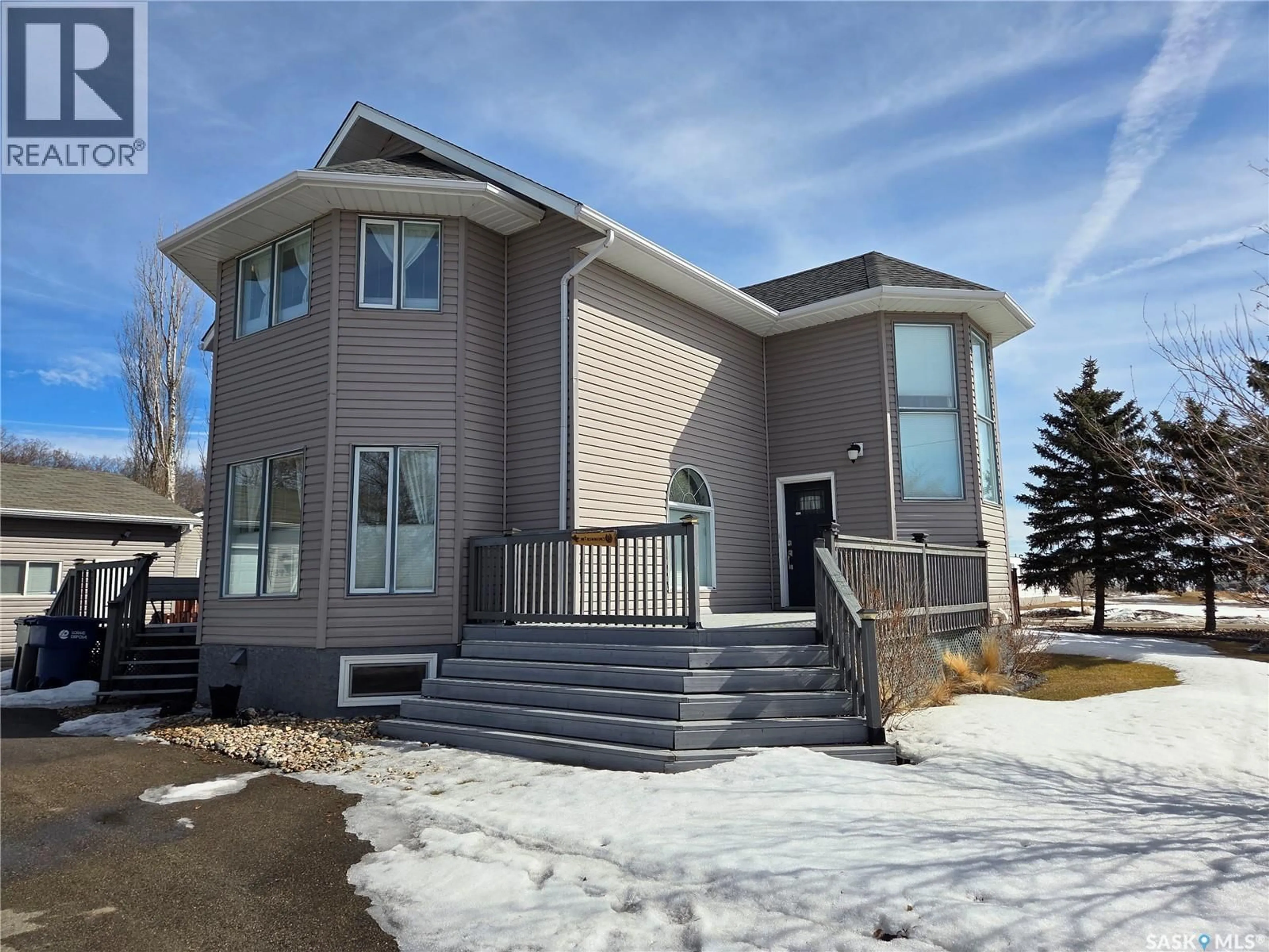 Home with vinyl exterior material, street for 218 2ND STREET, Carlyle Saskatchewan S0C0R0