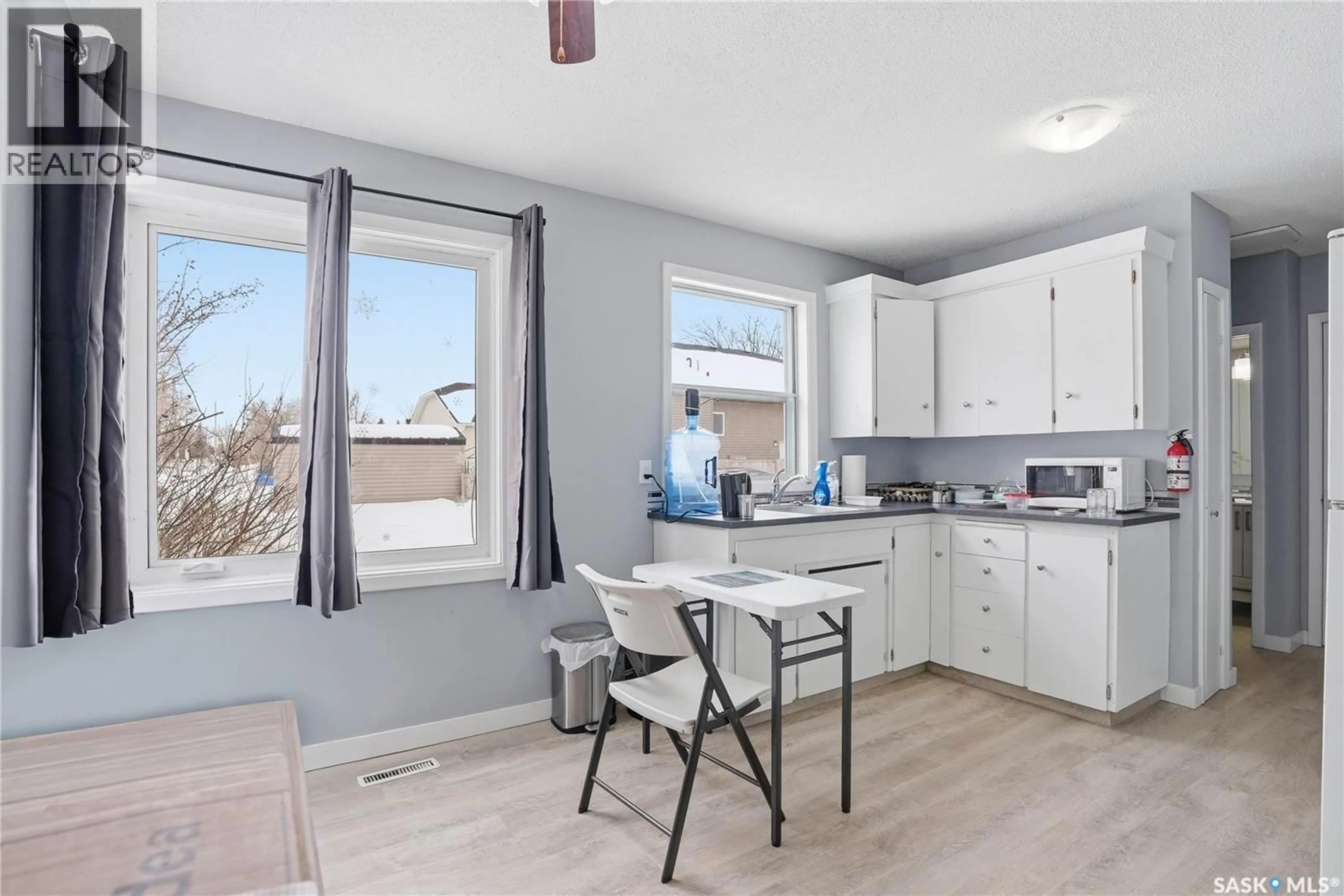 Open concept kitchen, wood/laminate floor for 43 BANTRY STREET, Lanigan Saskatchewan S0K2M0