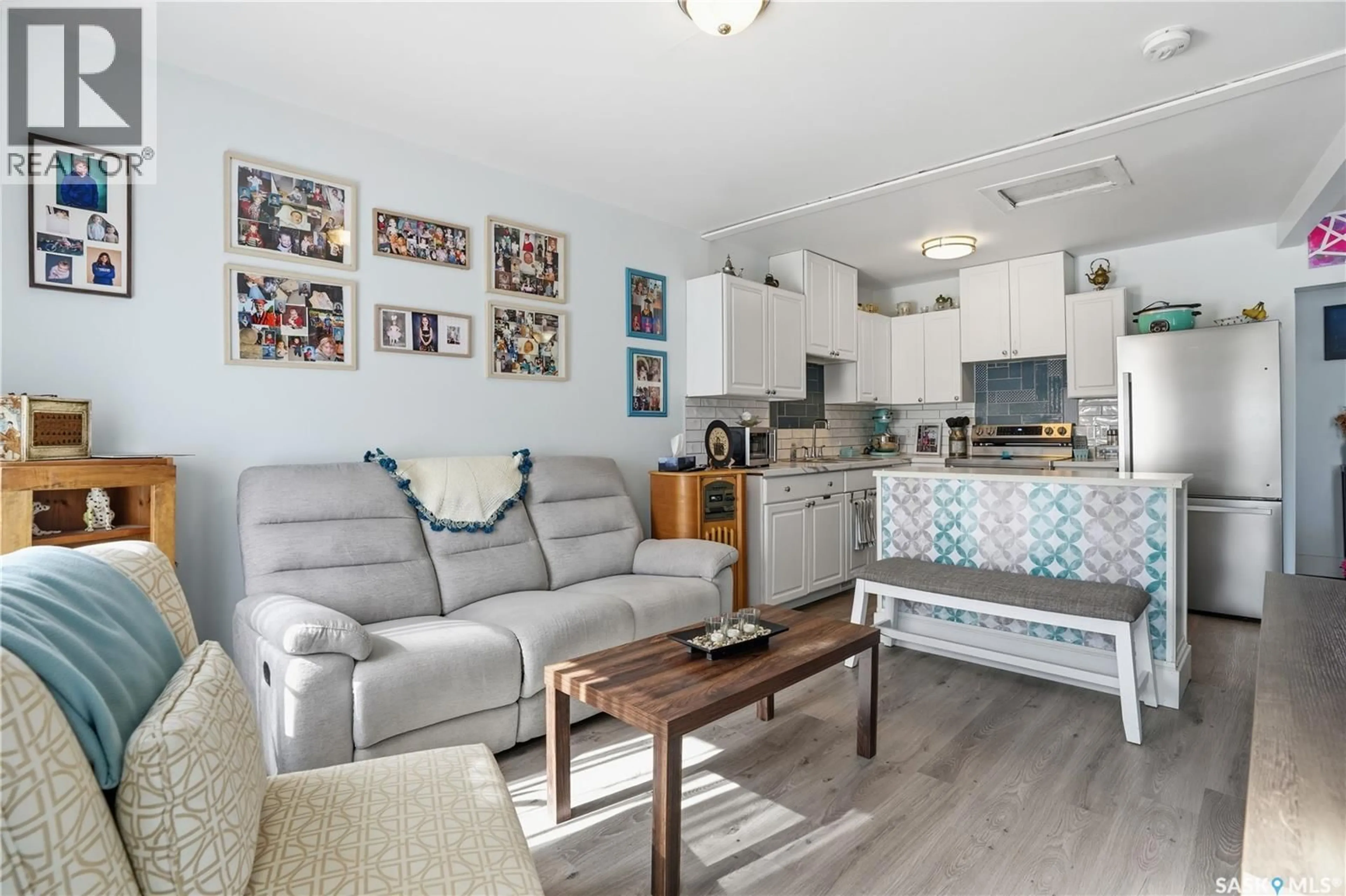 Living room with furniture, wood/laminate floor for 44 LILLOOET STREET, Moose Jaw Saskatchewan S6H4Y5