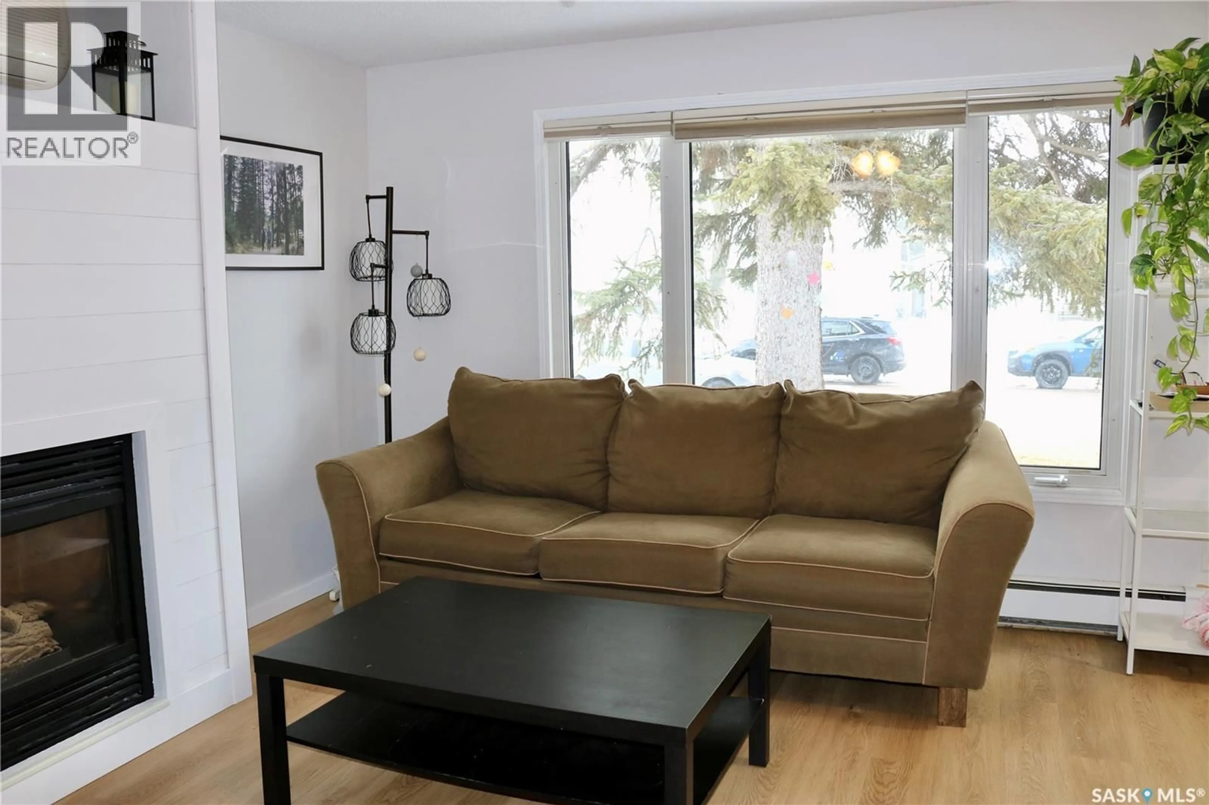 Living room with furniture, wood/laminate floor for 812 MCNAUGHTON STREET, Moosomin Saskatchewan S0G3N0