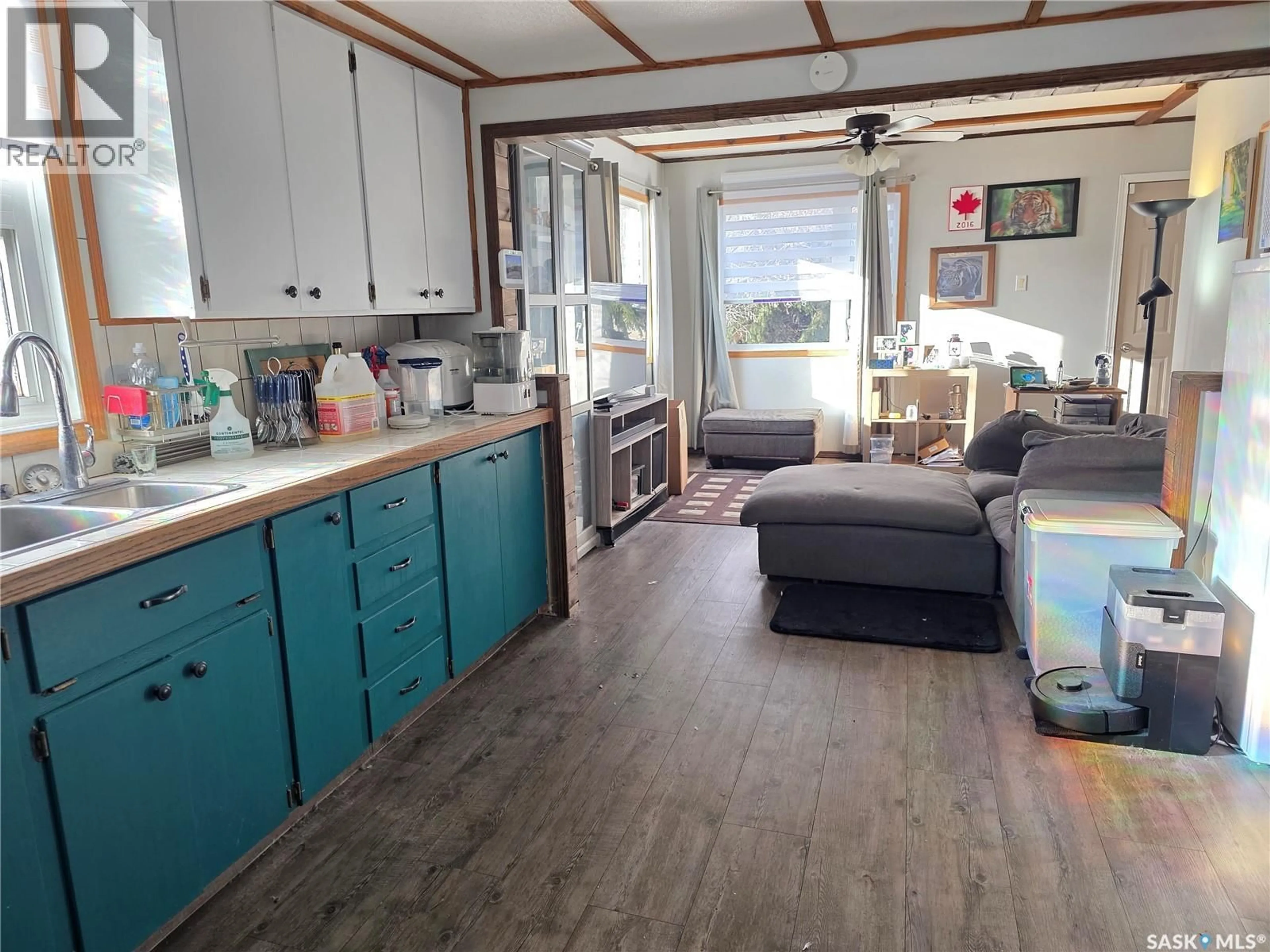 Open concept kitchen, wood/laminate floor for 1428 WINNIE STREET, Swift Current Saskatchewan S9H1R3