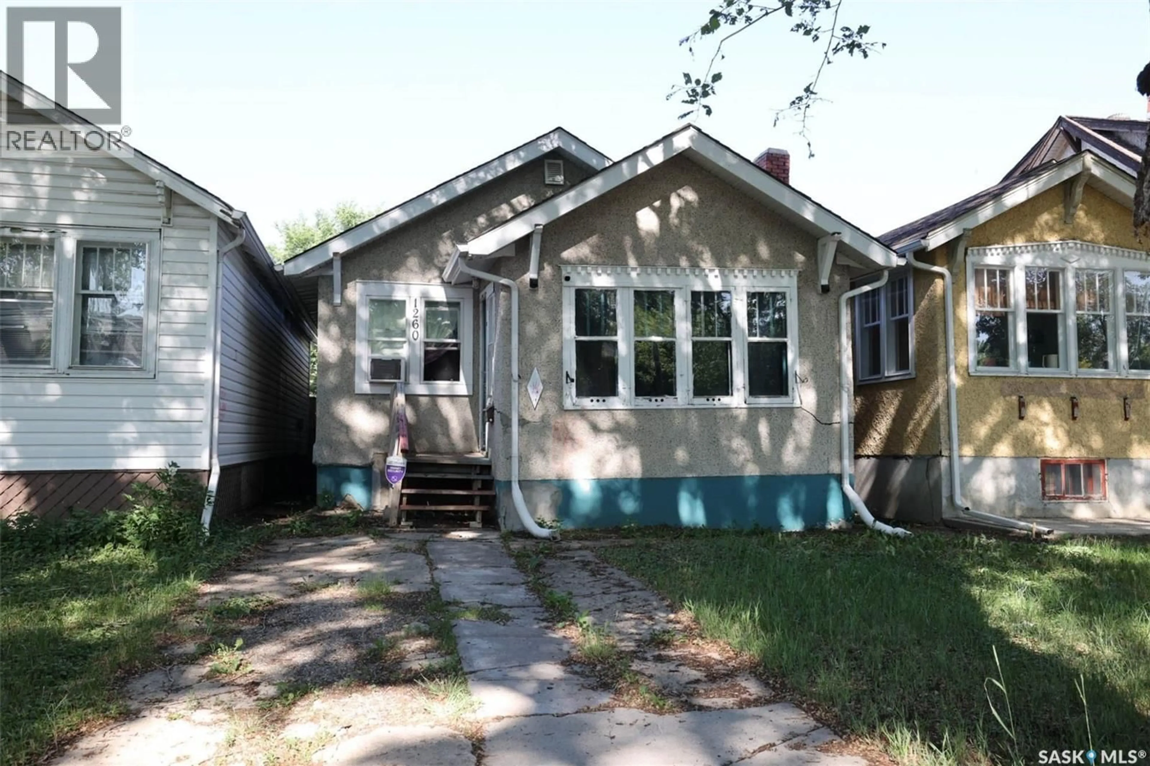 Home with vinyl exterior material, street for 1260 ROBINSON STREET, Regina Saskatchewan S4T2N2