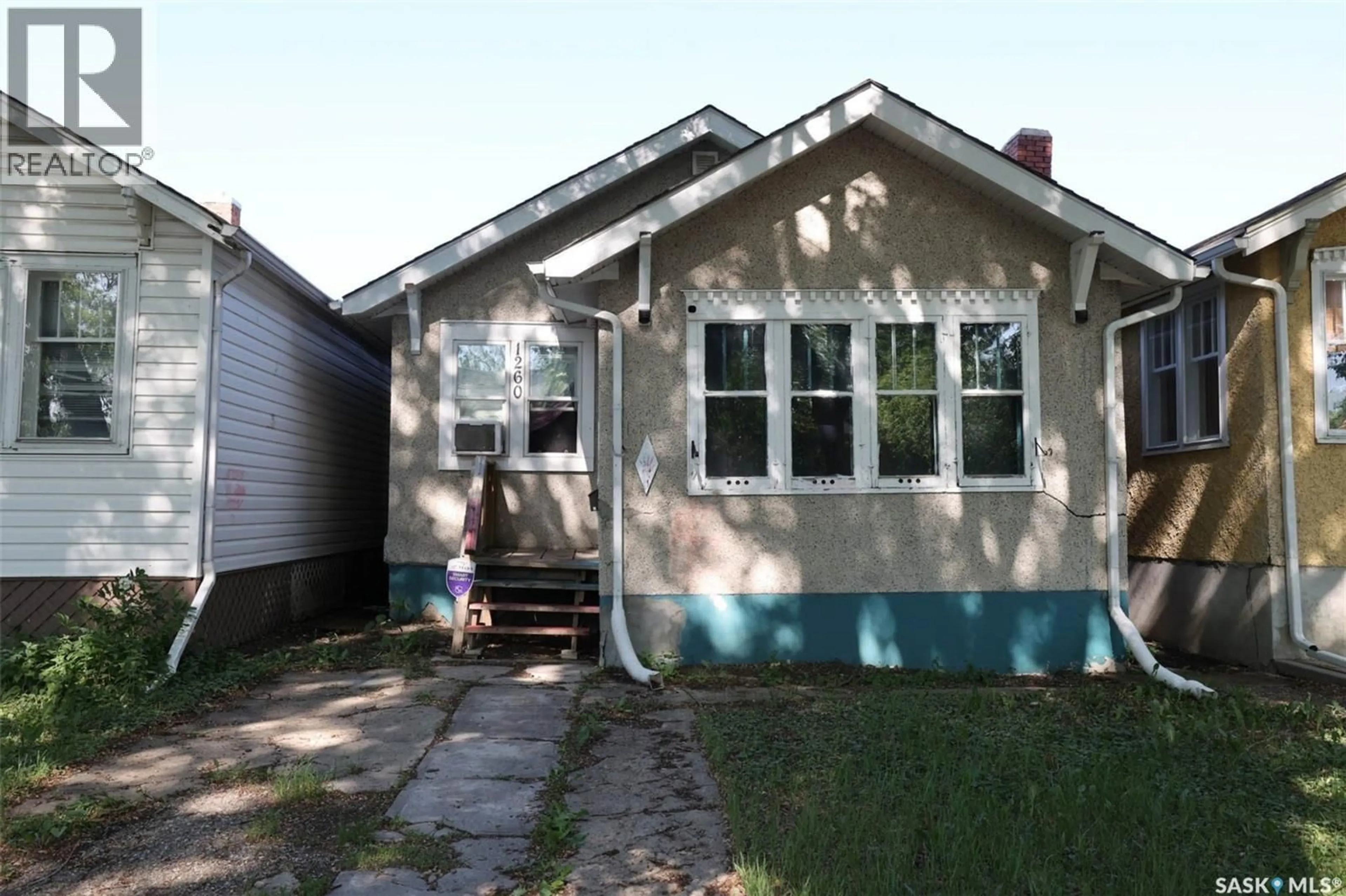 Home with vinyl exterior material, street for 1260 ROBINSON STREET, Regina Saskatchewan S4T2N2