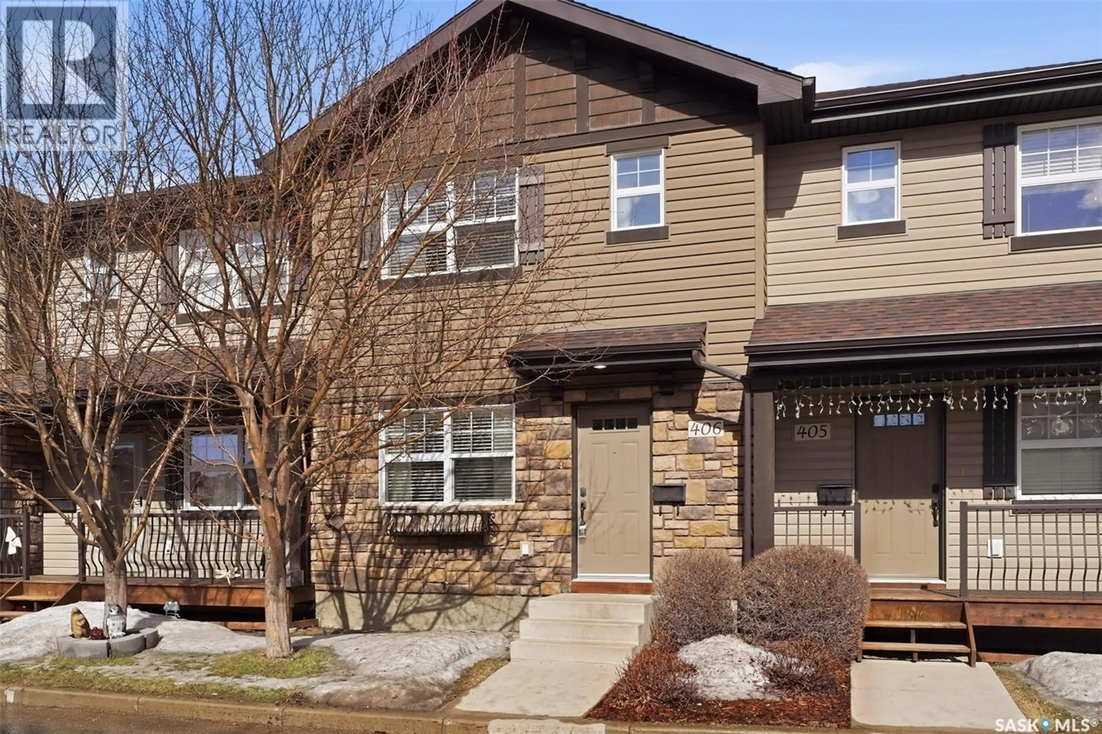 Home with vinyl exterior material, street for 406 150 LANGLOIS WAY, Saskatoon Saskatchewan S7T0L4