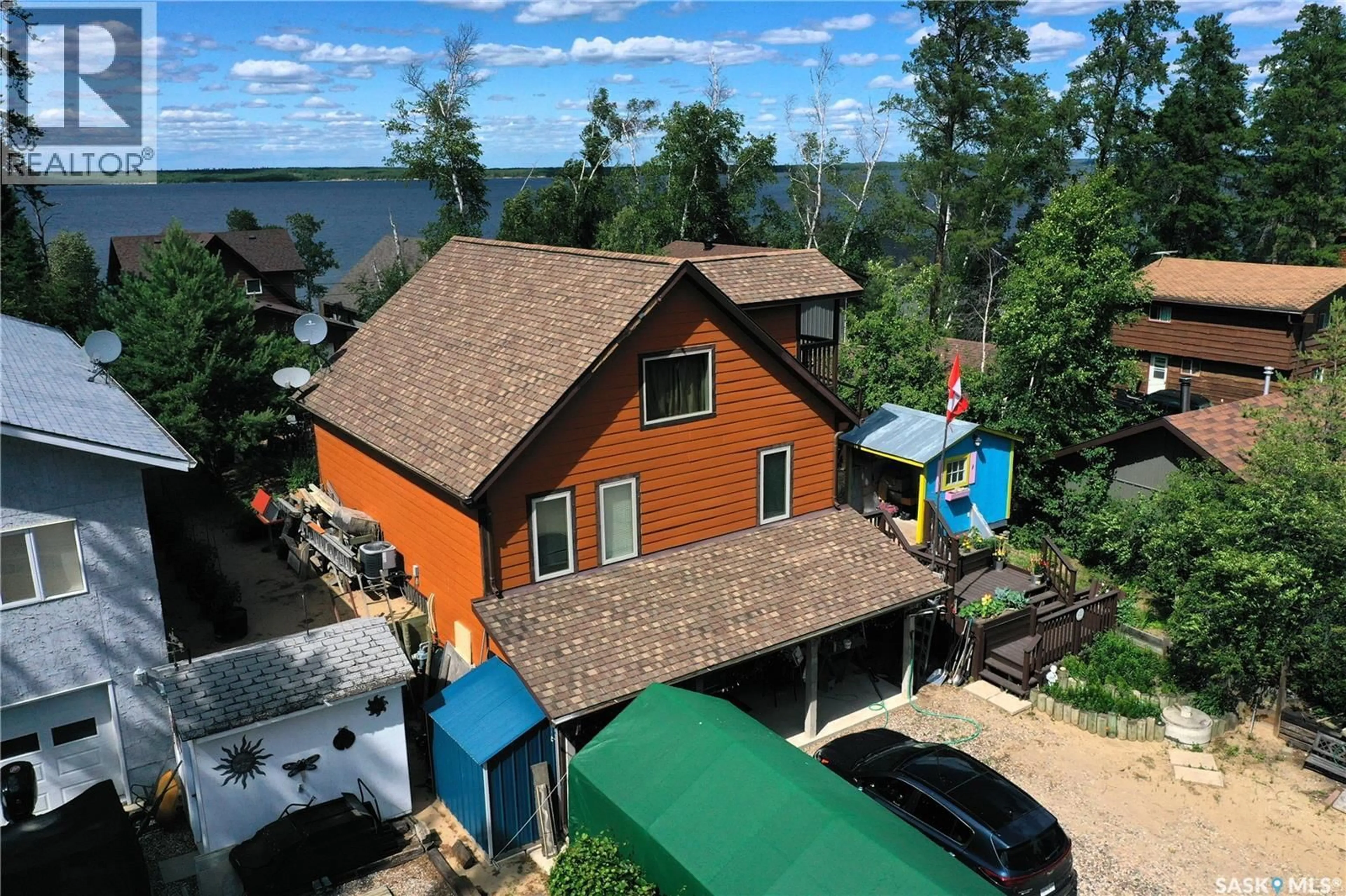 A pic from outside/outdoor area/front of a property/back of a property/a pic from drone, water/lake/river/ocean view for 621 PINE DRIVE, Tobin Lake Saskatchewan S0E1E0