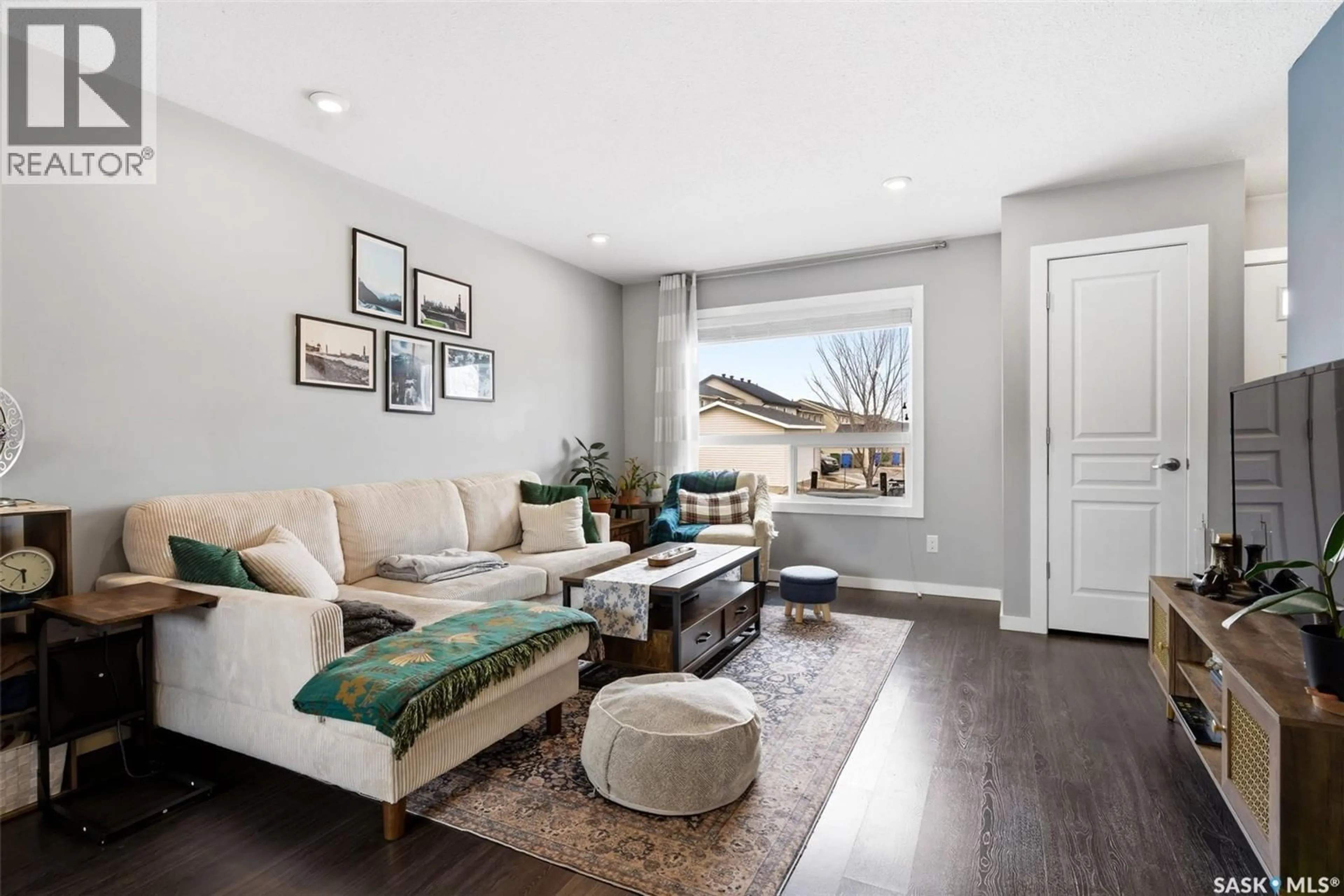 Living room with furniture, wood/laminate floor for 5219 BEACON WAY, Regina Saskatchewan S4W0J3