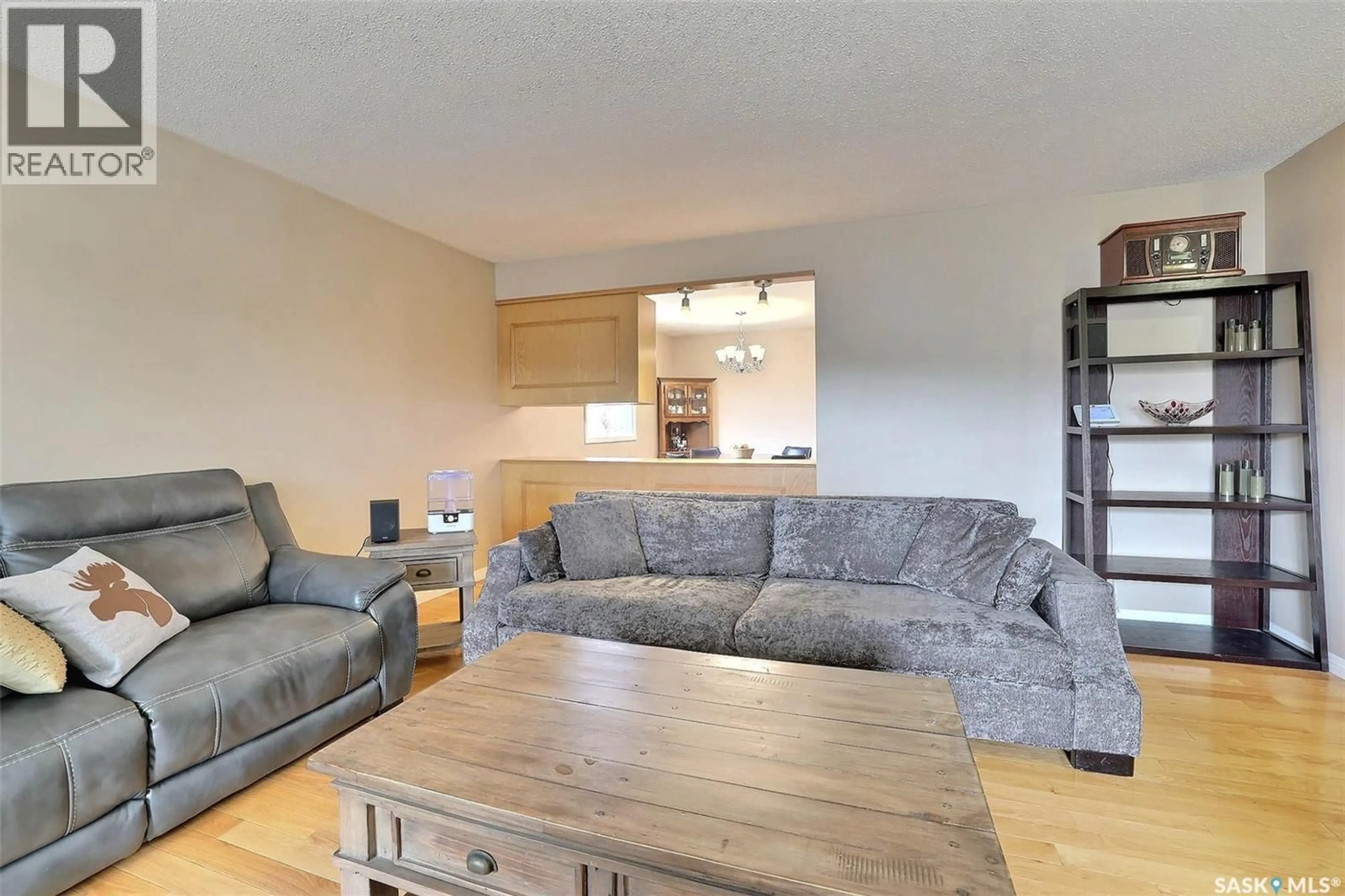 Living room with furniture, wood/laminate floor for 5450 SHERWOOD DRIVE, Regina Saskatchewan S4R5M3