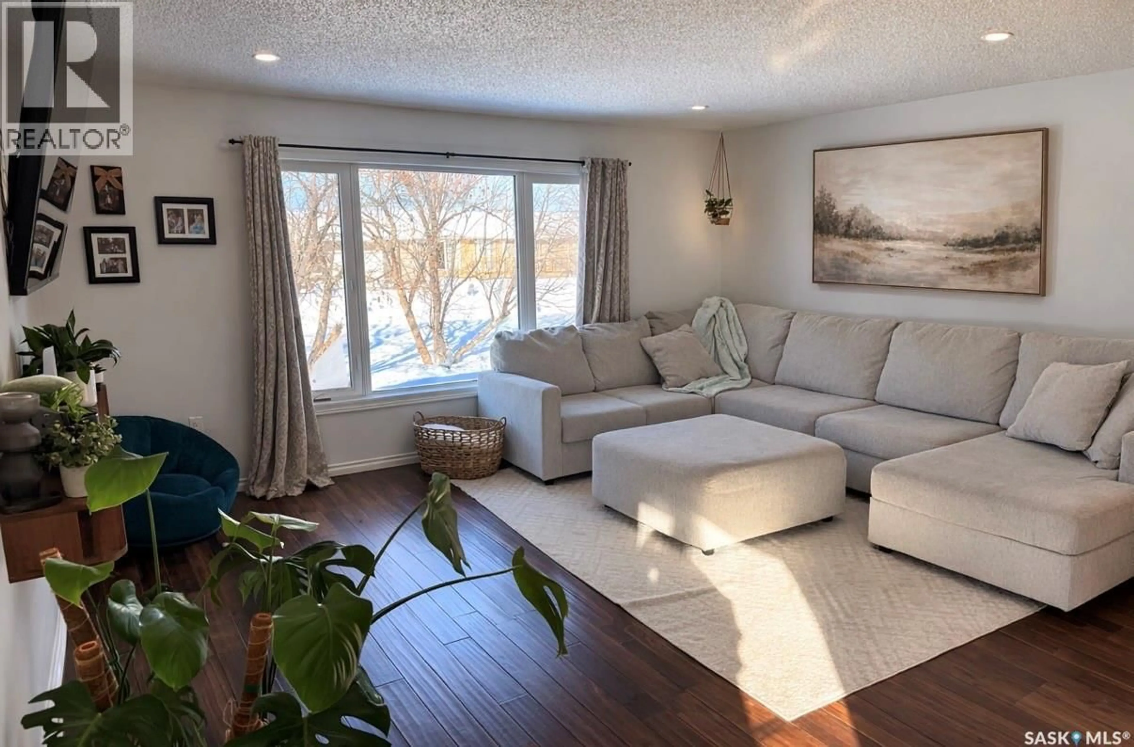 Living room with furniture, wood/laminate floor for 420 LOGAN AVENUE, White Fox Saskatchewan S0J0B1