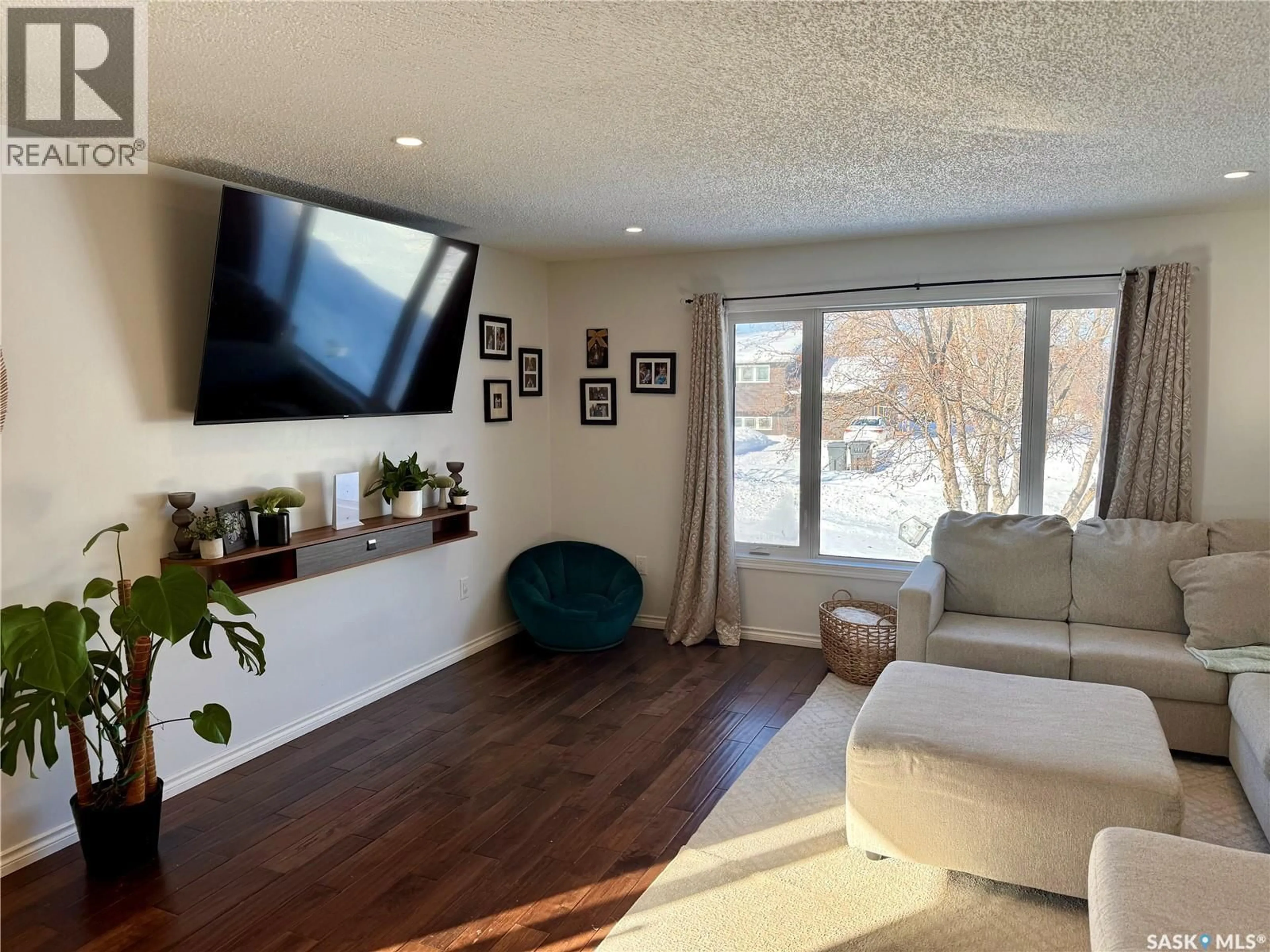 Living room with furniture, wood/laminate floor for 420 LOGAN AVENUE, White Fox Saskatchewan S0J0B1