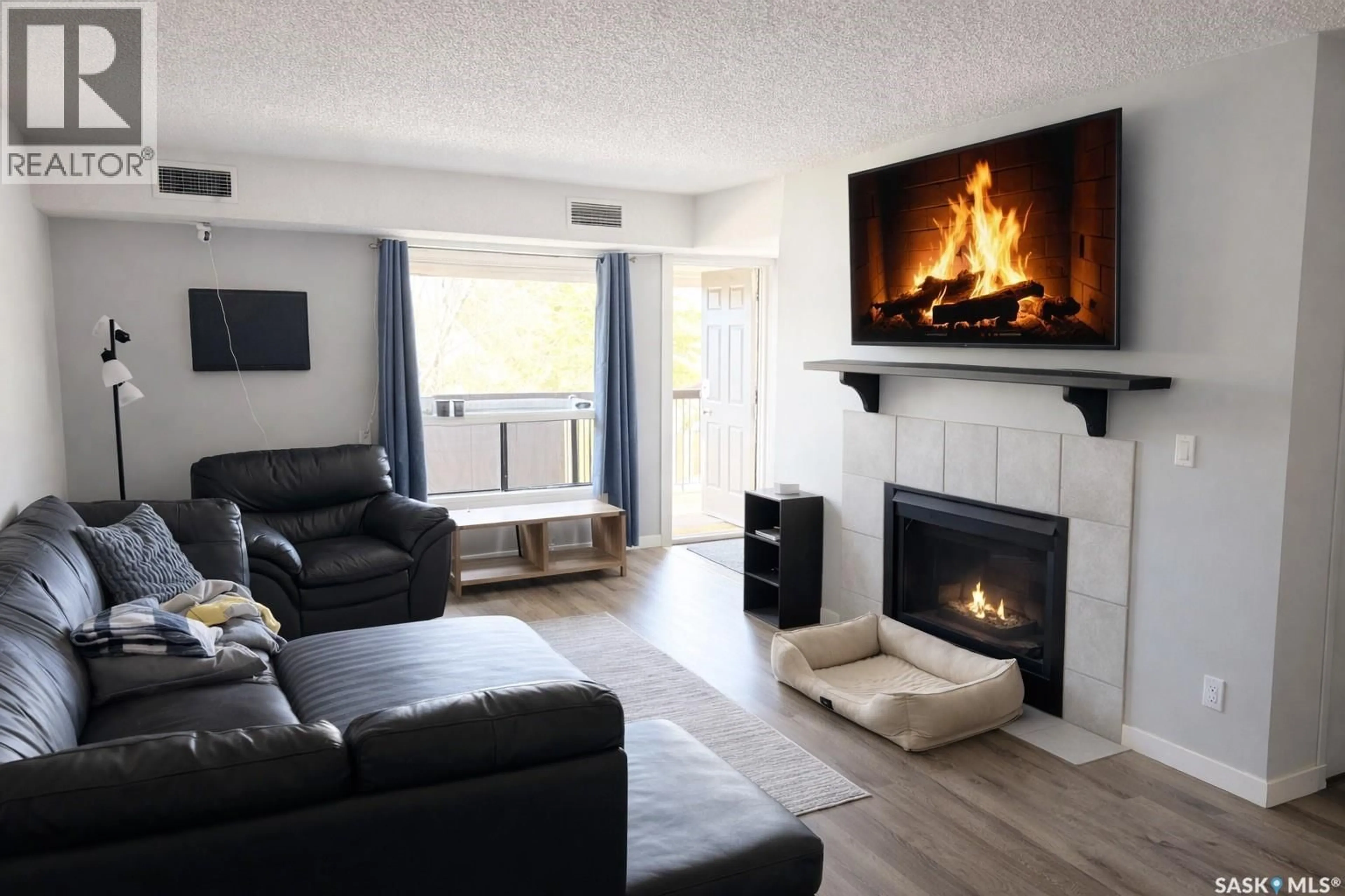 Living room with furniture, wood/laminate floor for 116 GORE PLACE, Regina Saskatchewan S4T7S4