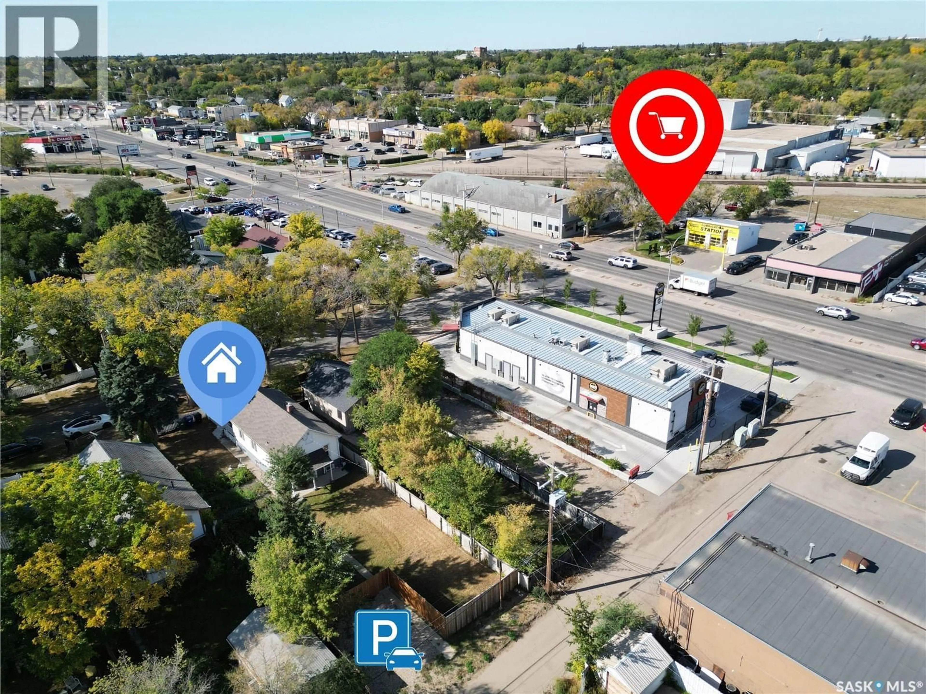 A pic from outside/outdoor area/front of a property/back of a property/a pic from drone, street for 114 E AVENUE, Saskatoon Saskatchewan S7M1R6