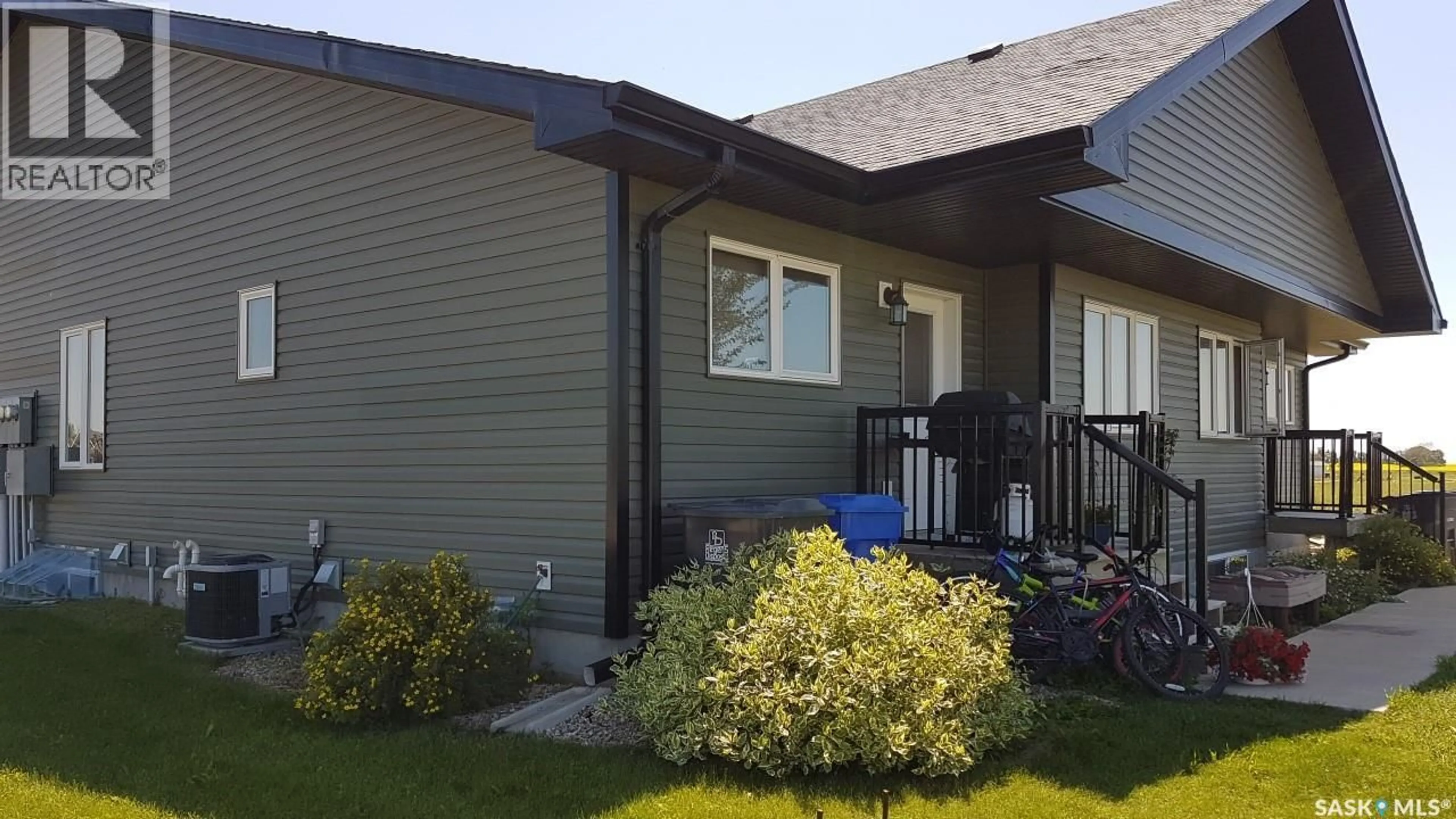 Home with vinyl exterior material, street for 1 201 CARLYLE AVENUE, Carlyle Saskatchewan S0C0R0